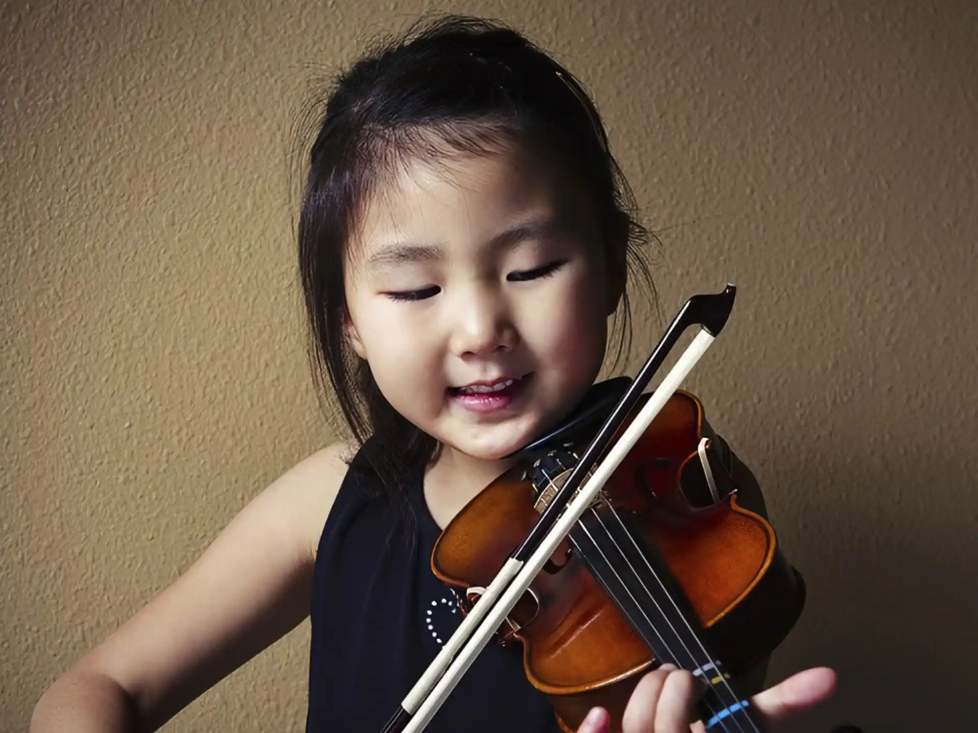 a girl playing a violin