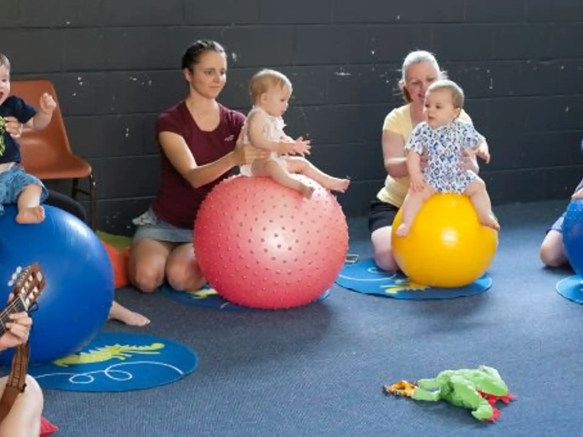 a group of people sitting on balls