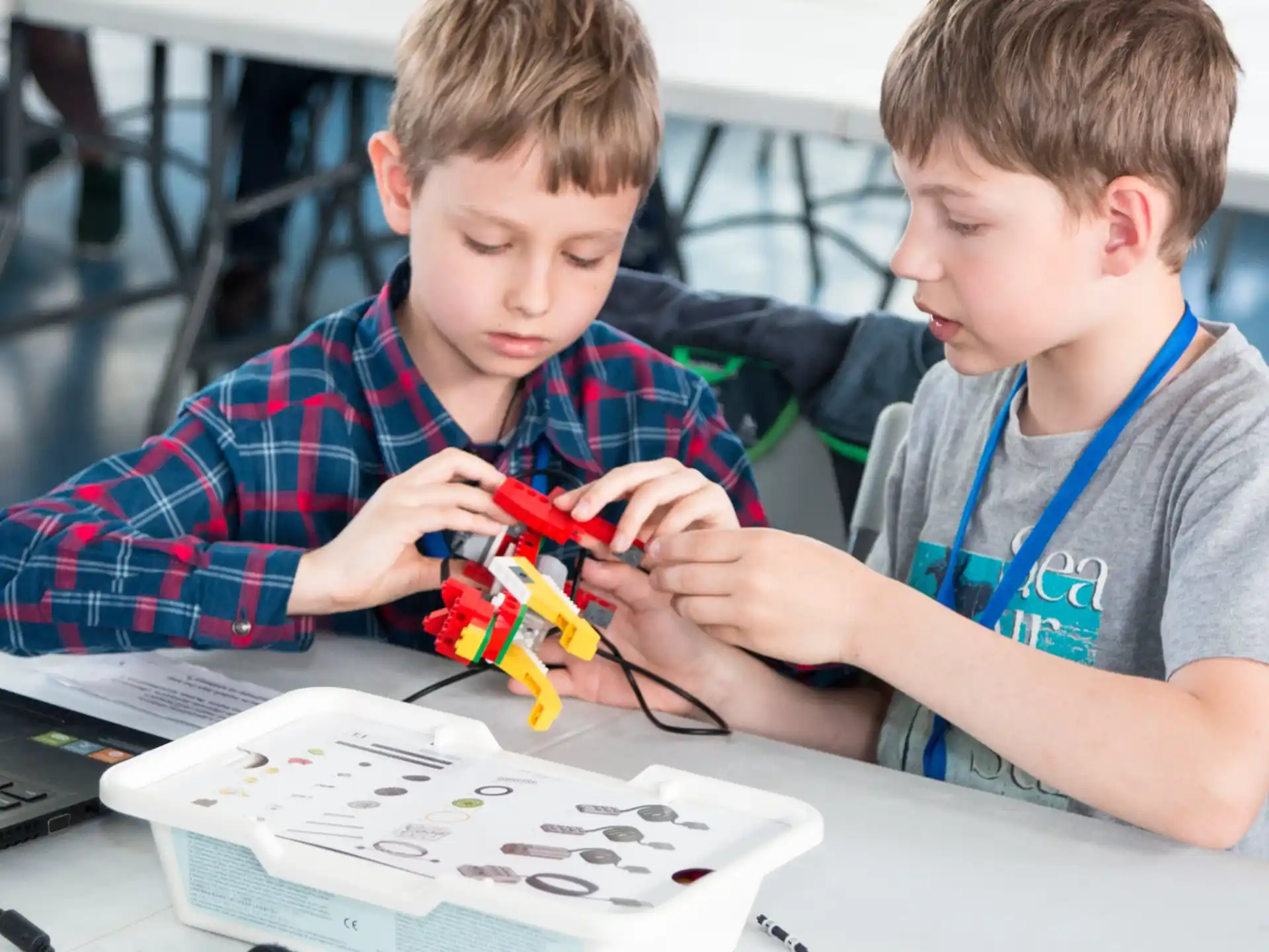 a couple of boys playing with a toy