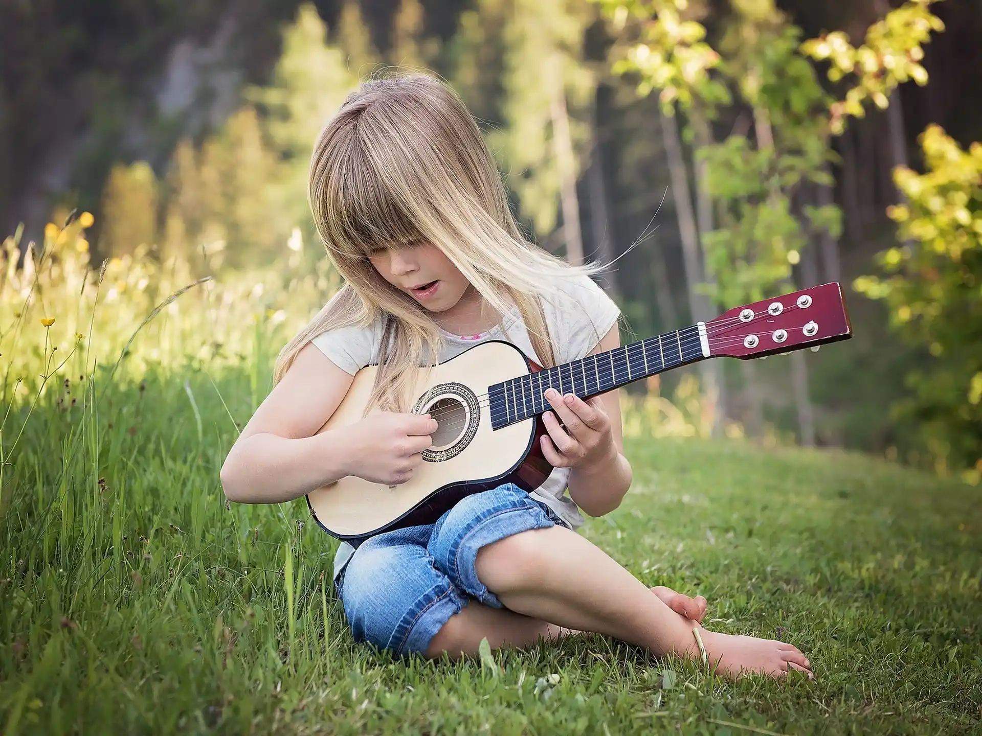 a girl playing a guitar