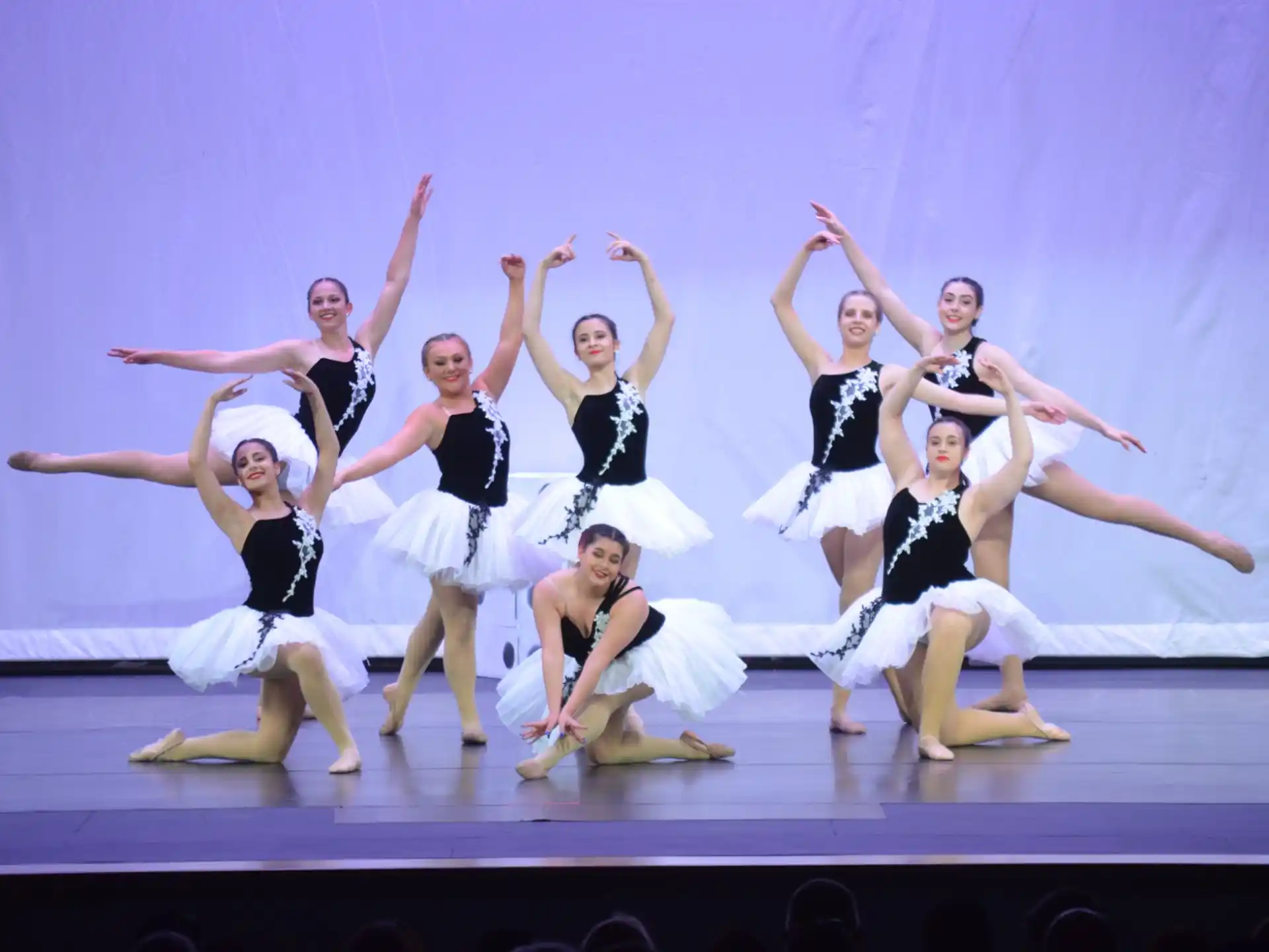 a group of women dancing on a stage