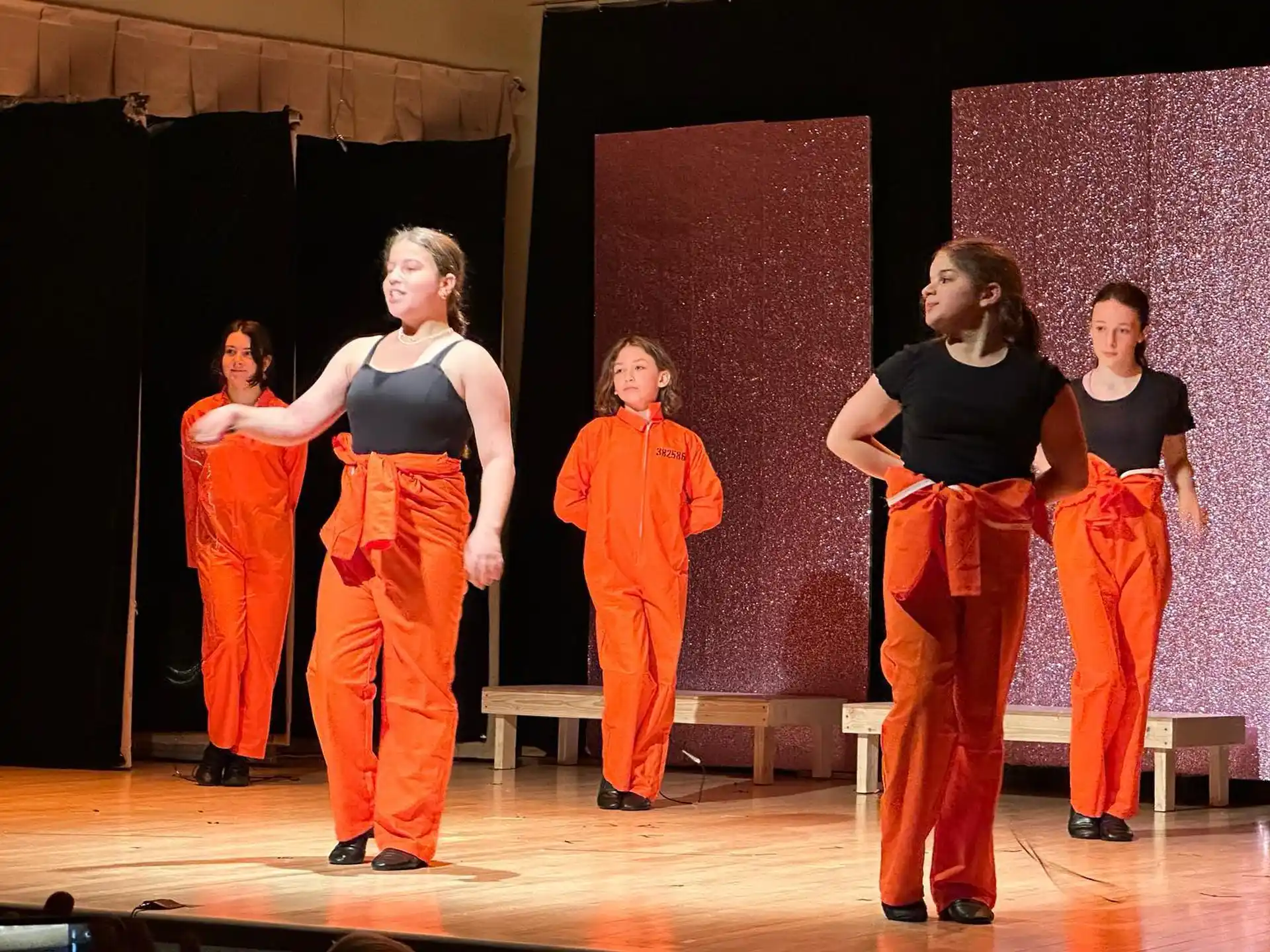 a group of women on a stage