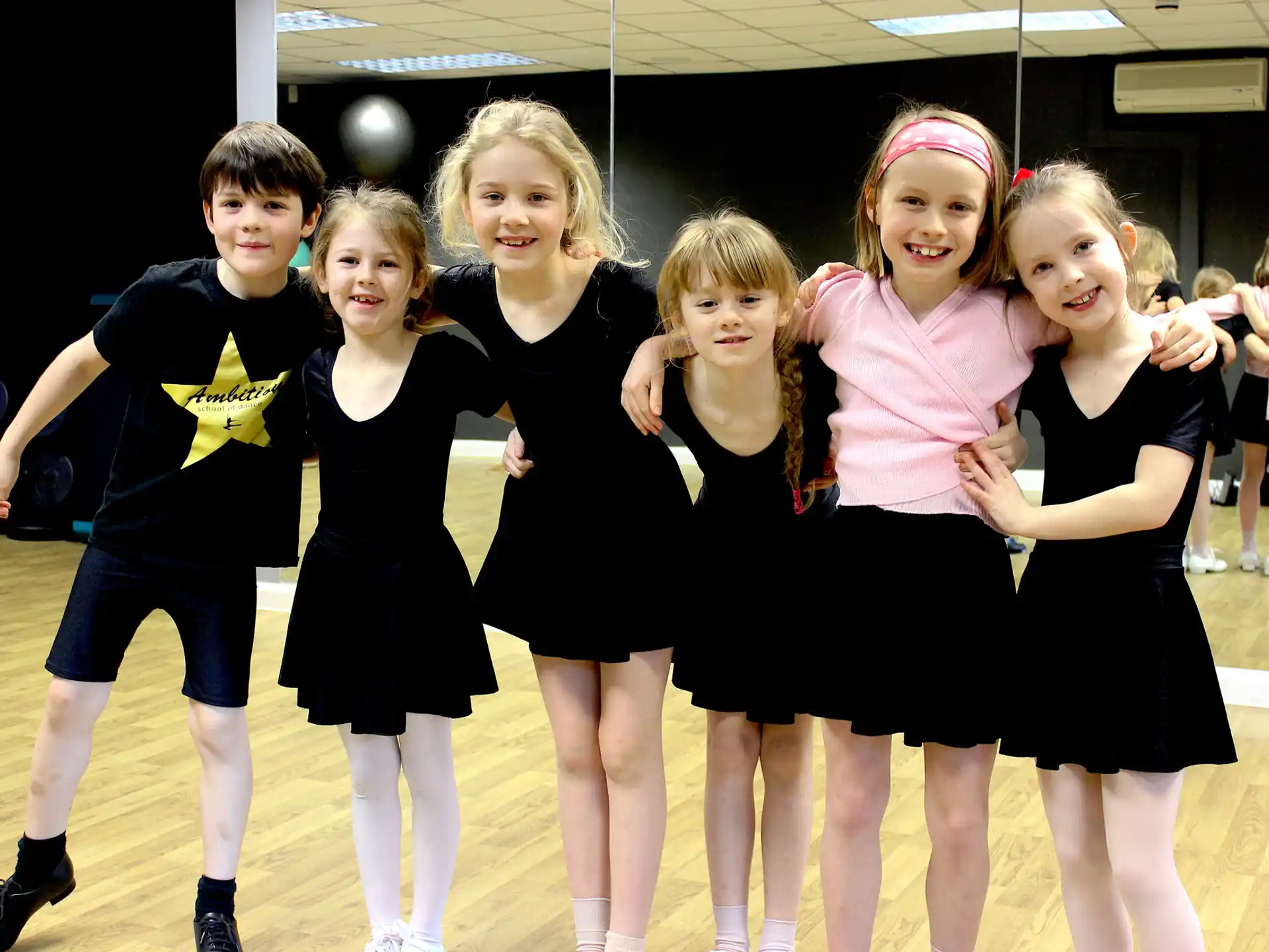 a group of girls posing for a picture