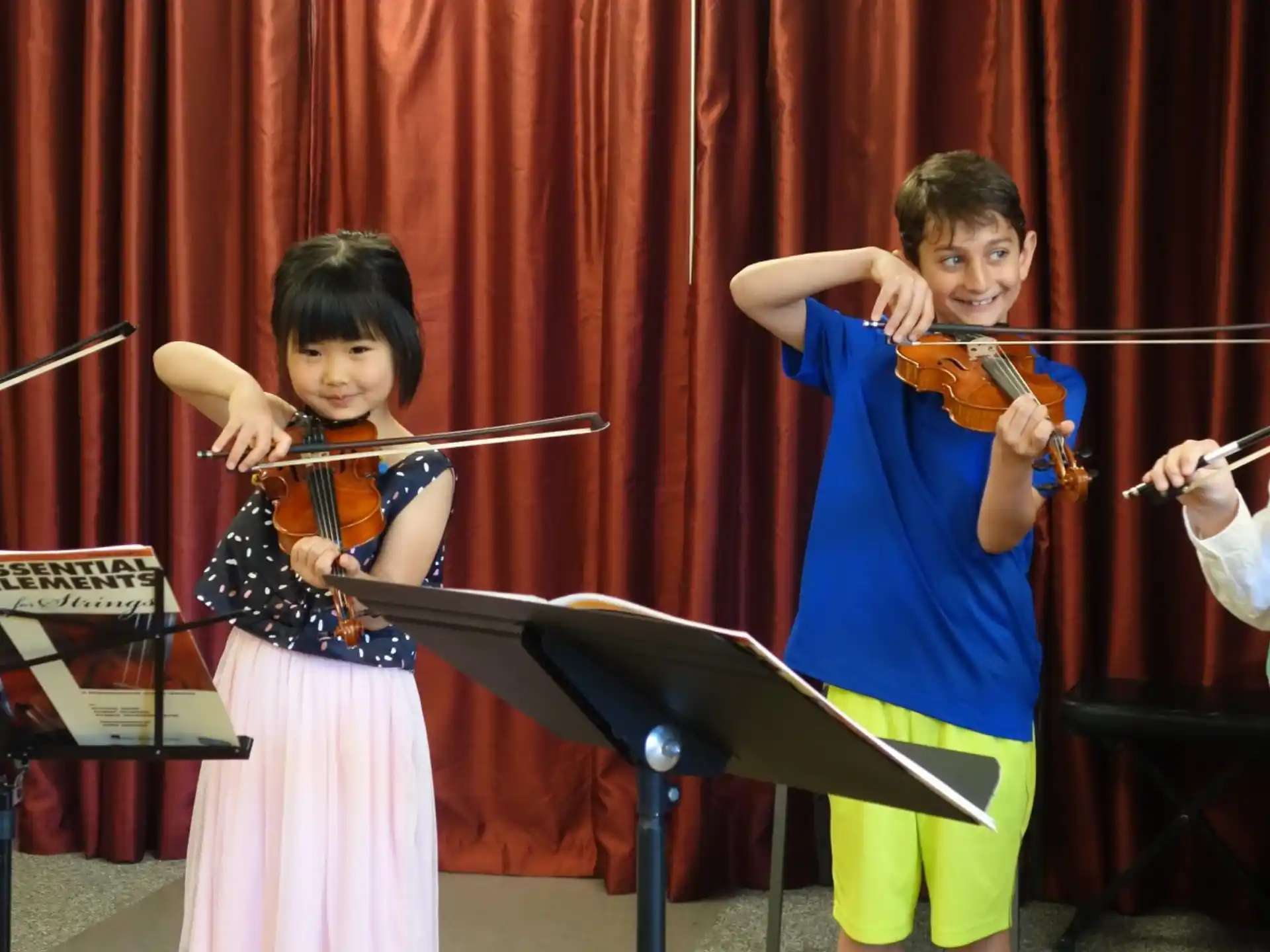 a group of kids playing musical instruments