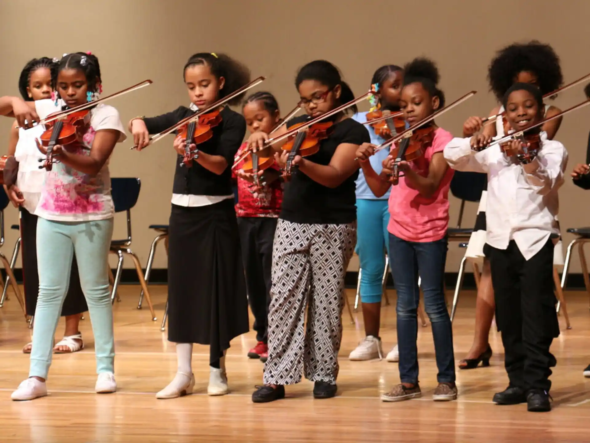 a group of children playing instruments