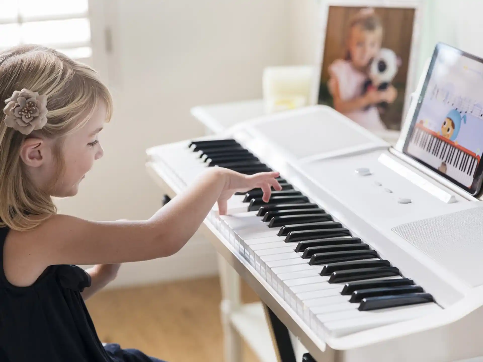 a girl playing a piano