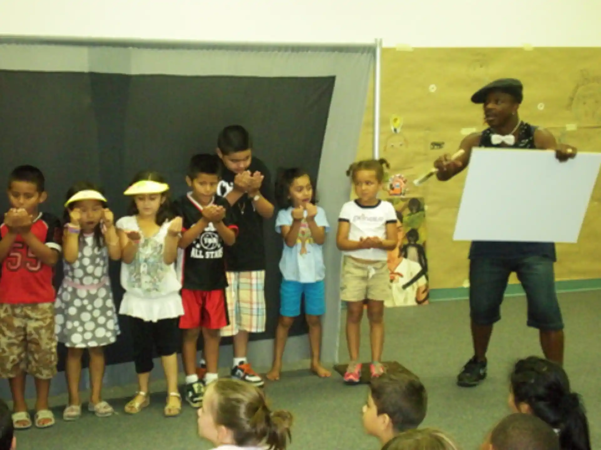 a group of children holding a sign