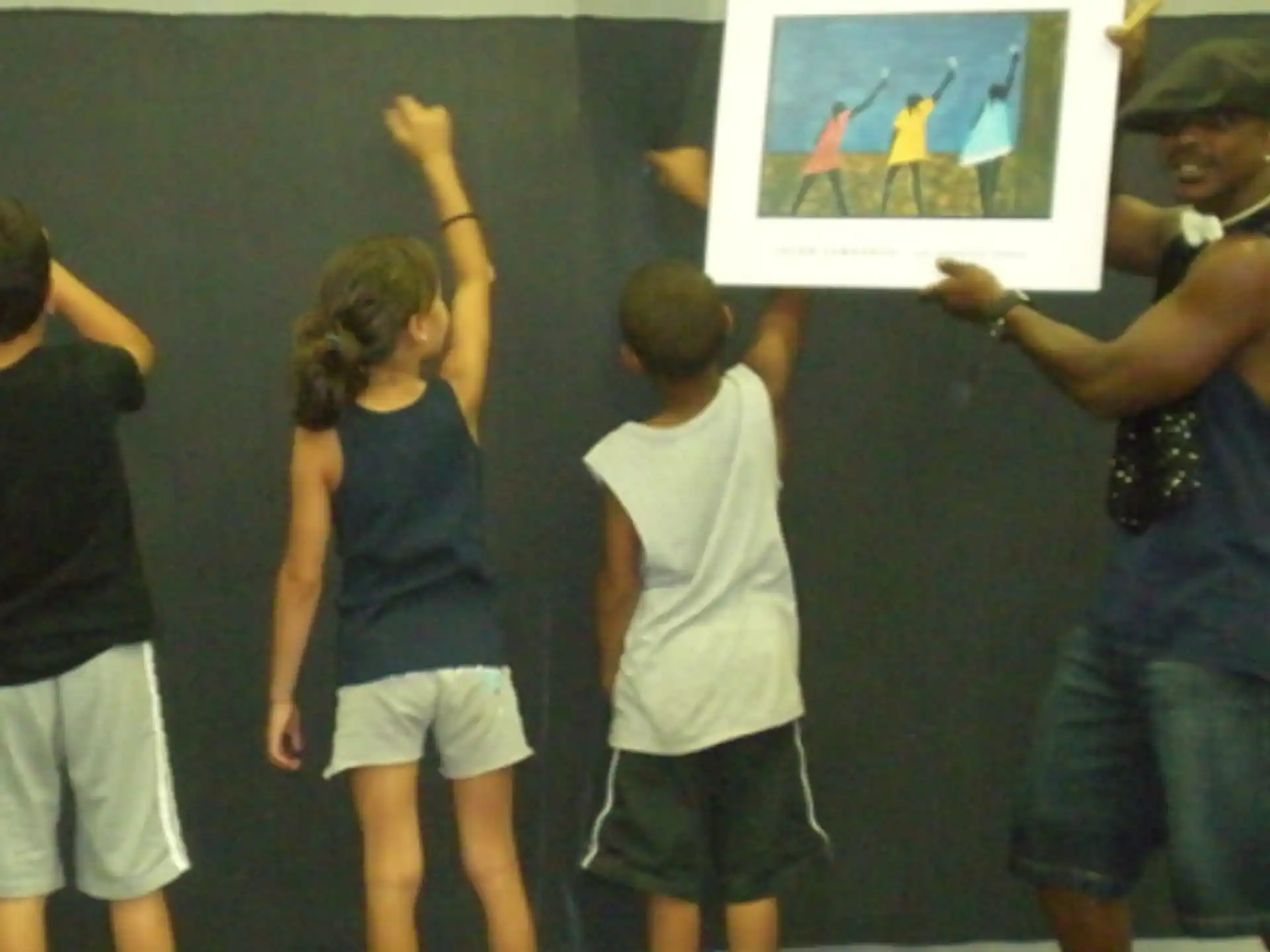 a group of people looking at a television screen