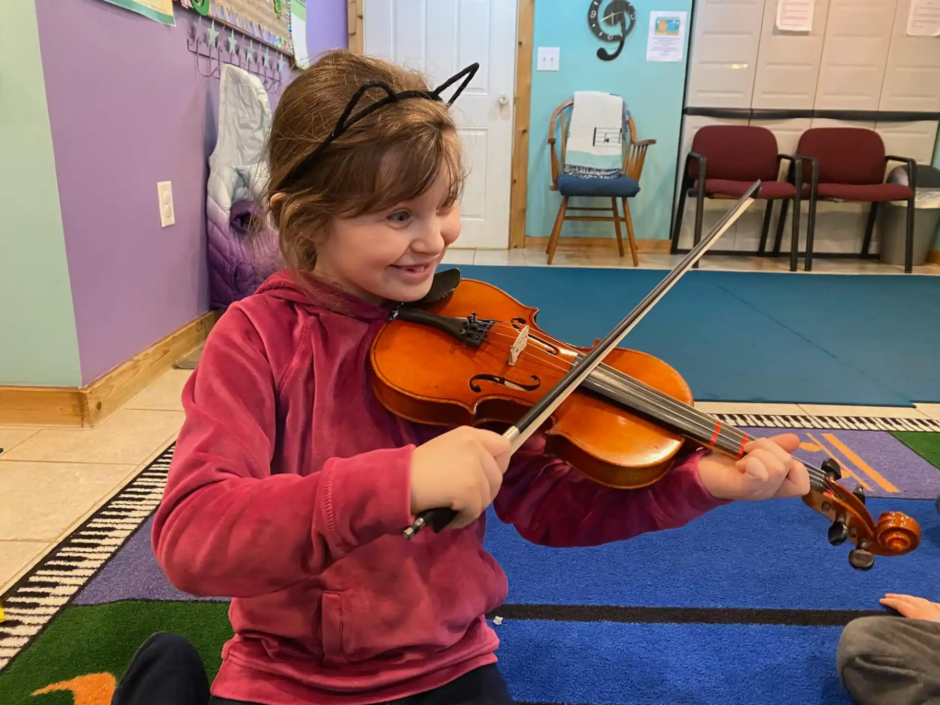 a girl playing a violin