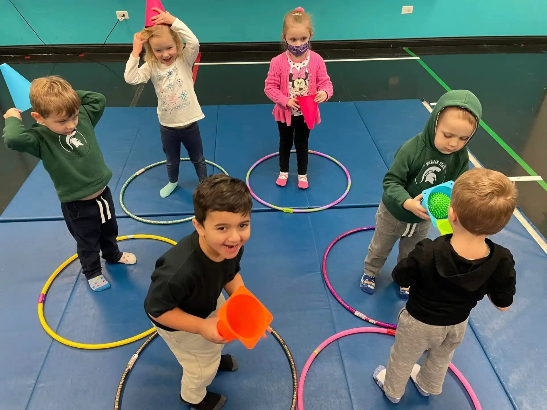 a group of children playing on a mat