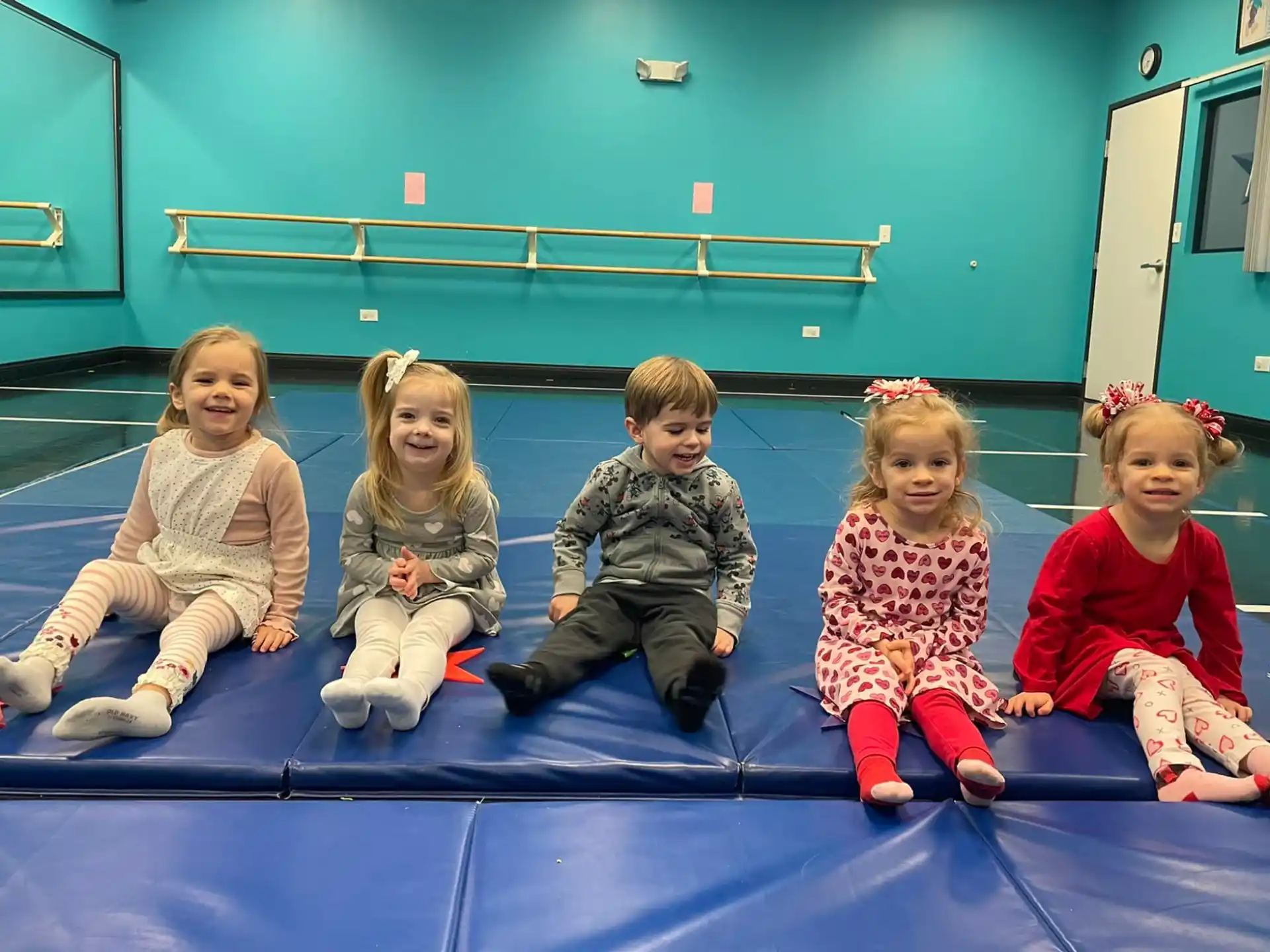 a group of children sitting on the floor