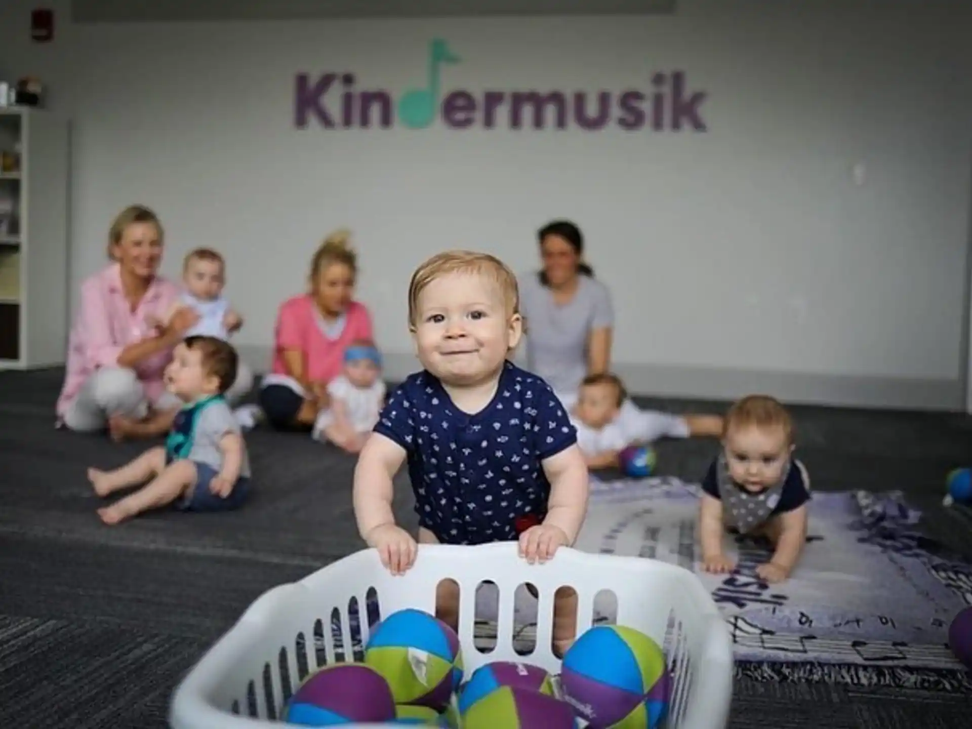 a group of children sitting on the floor