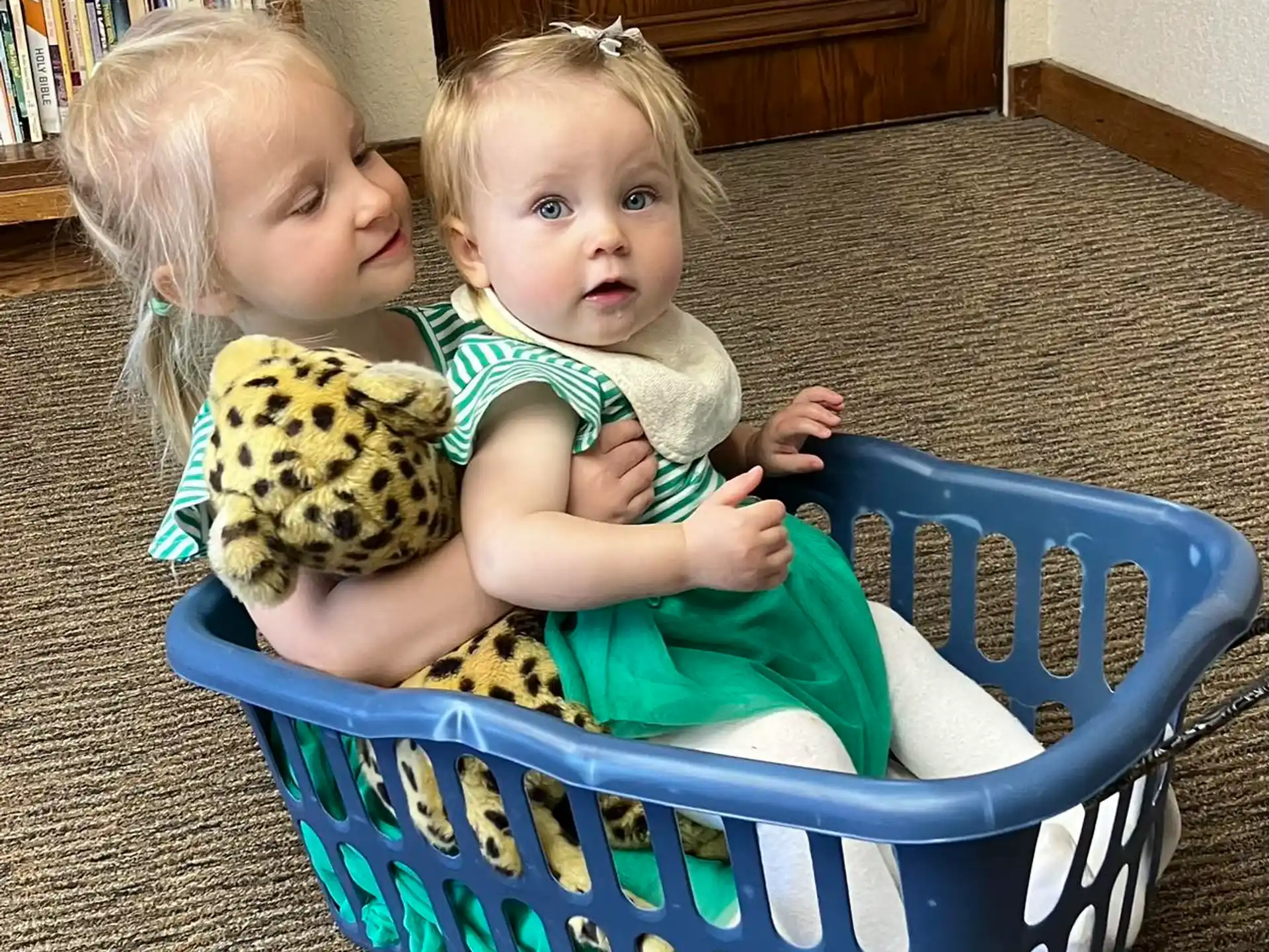 a couple of children sitting on a chair