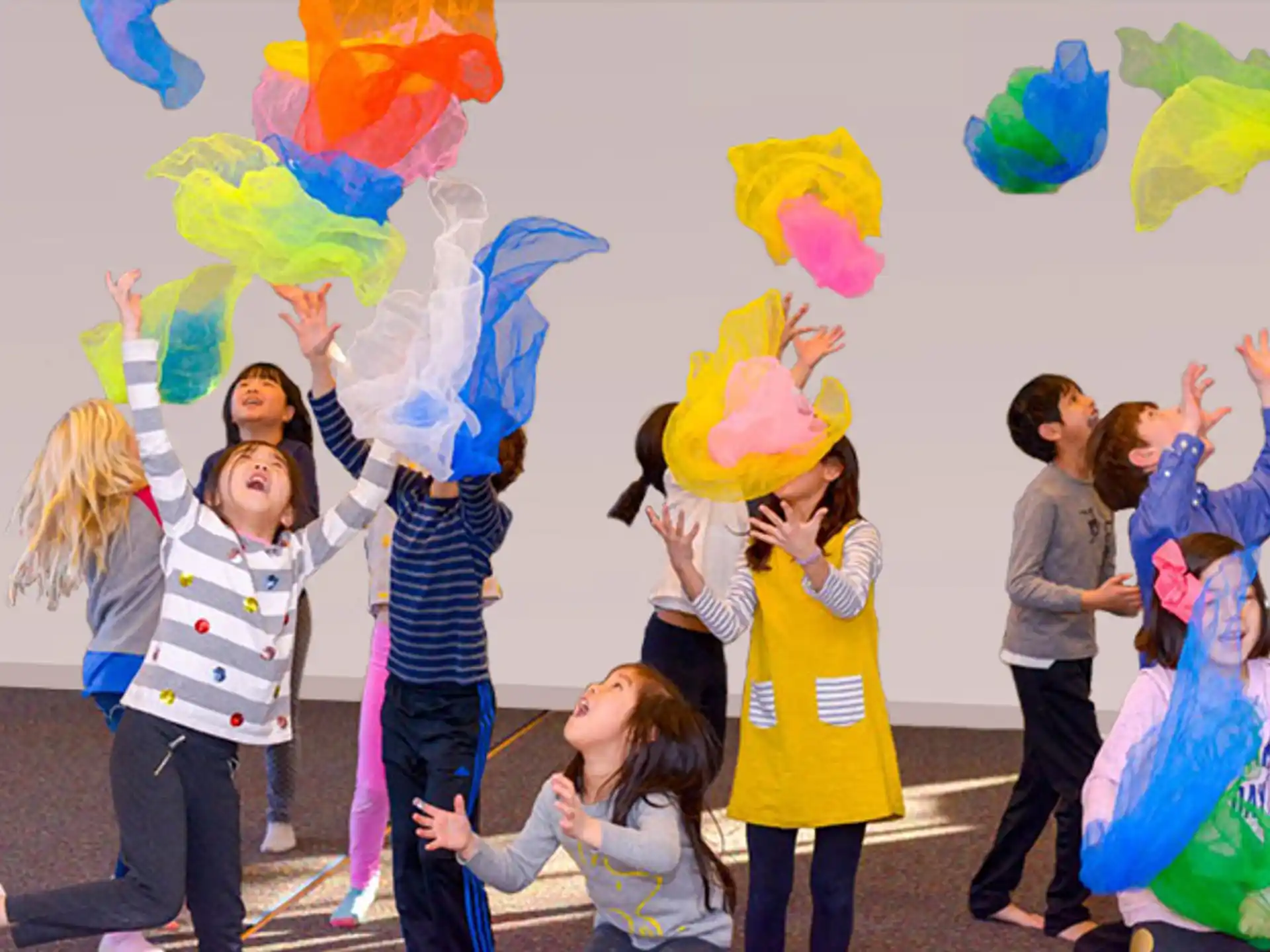a group of people holding colorful kites