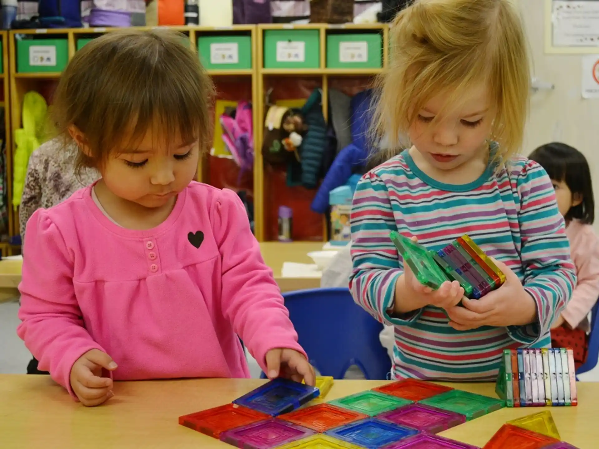 a couple of young girls playing a game