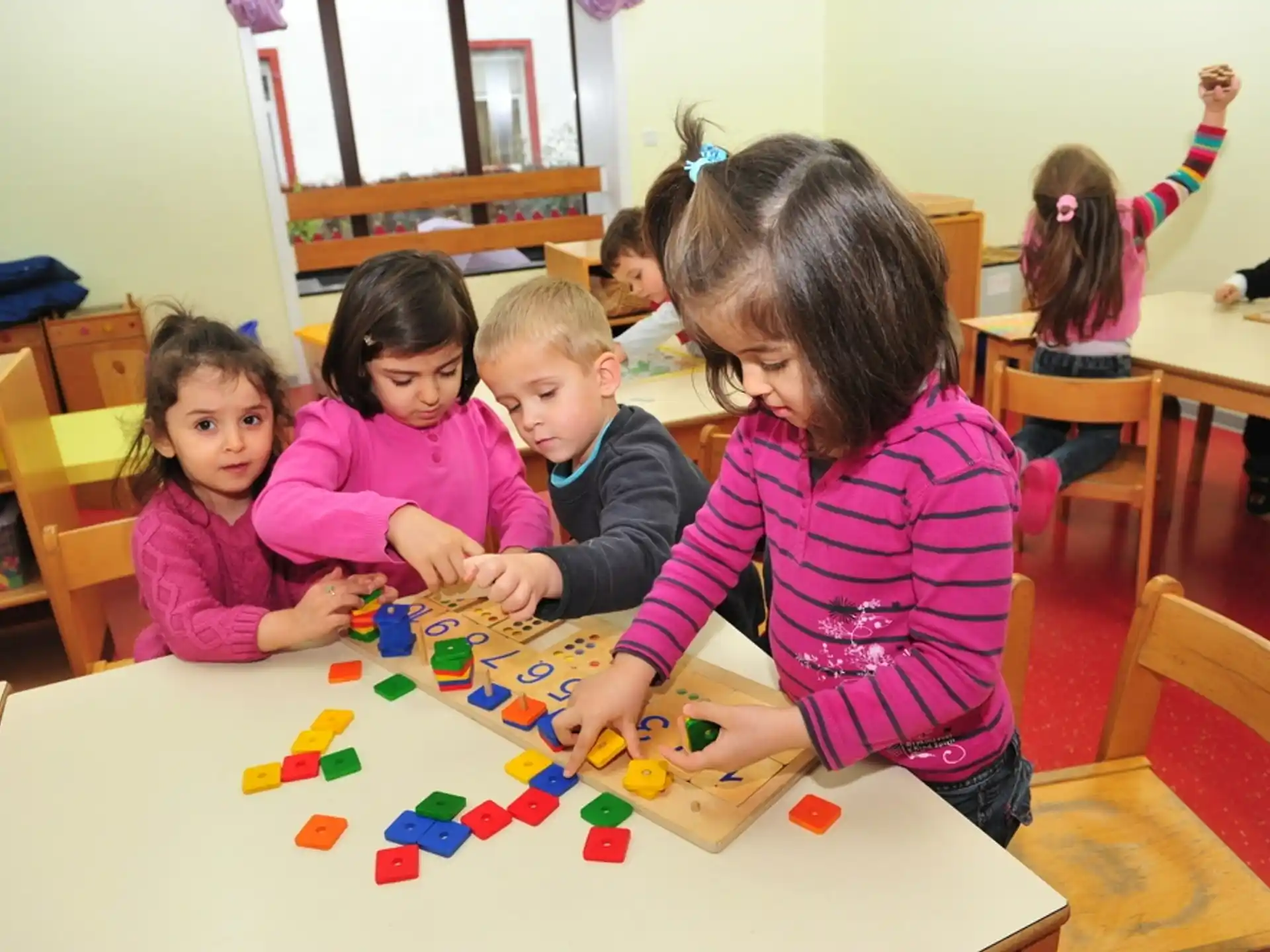 a group of children playing with toys