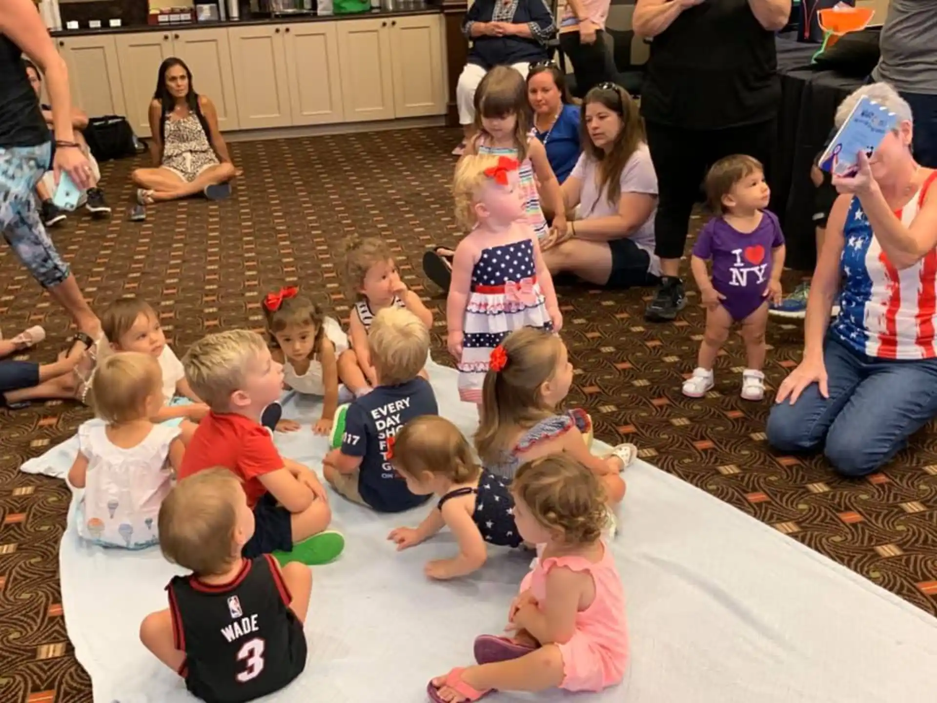a group of children sitting on the floor