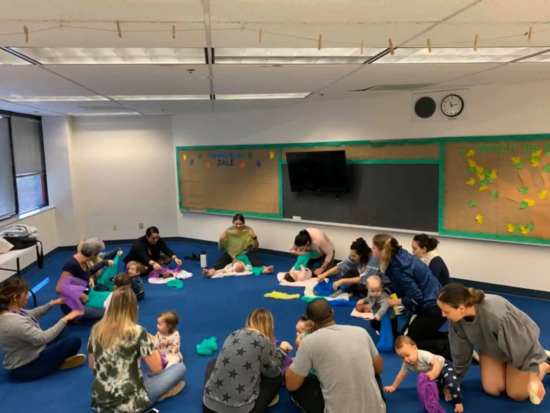 a group of people sitting in a classroom