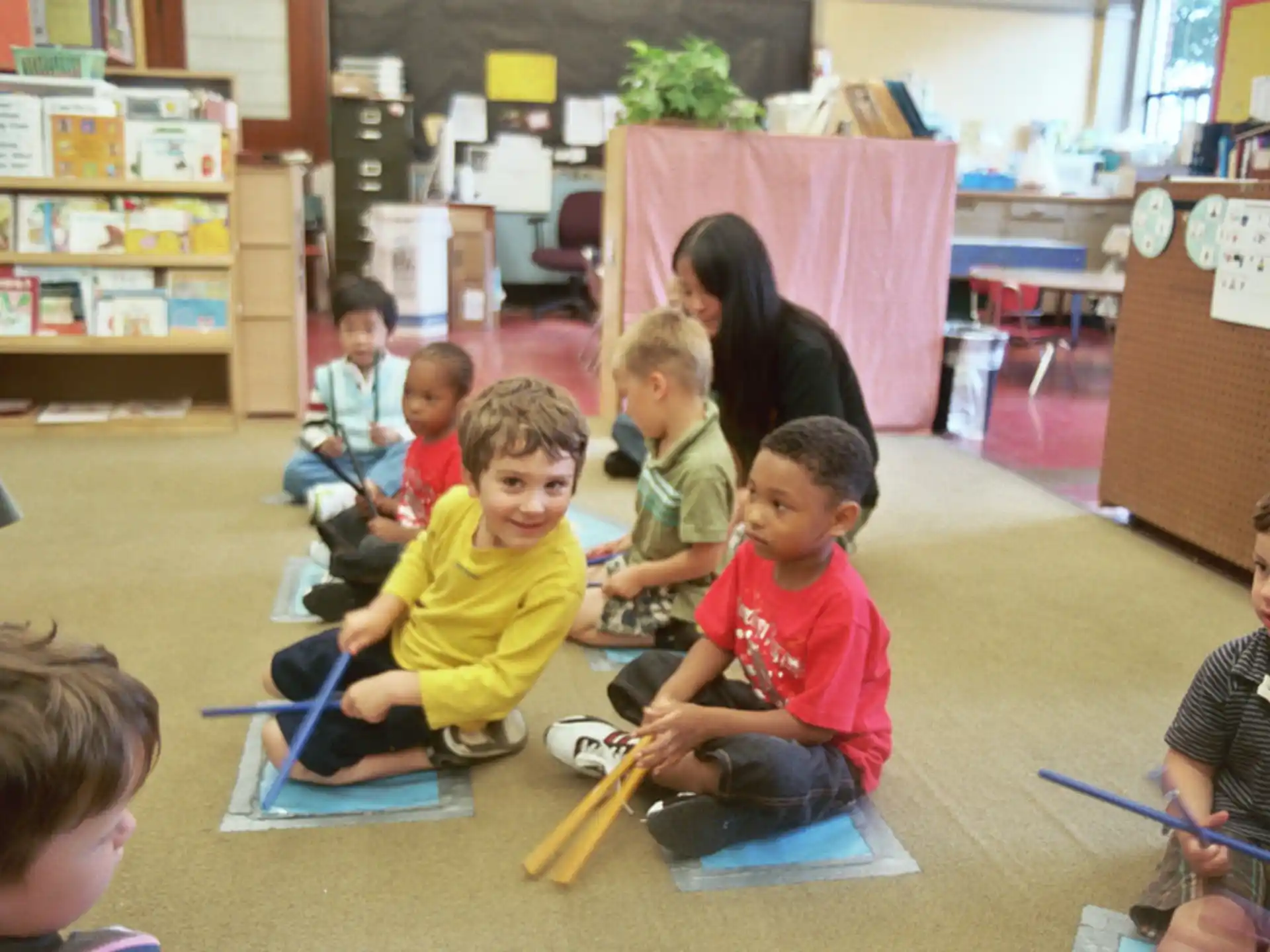 a group of children sitting on the floor
