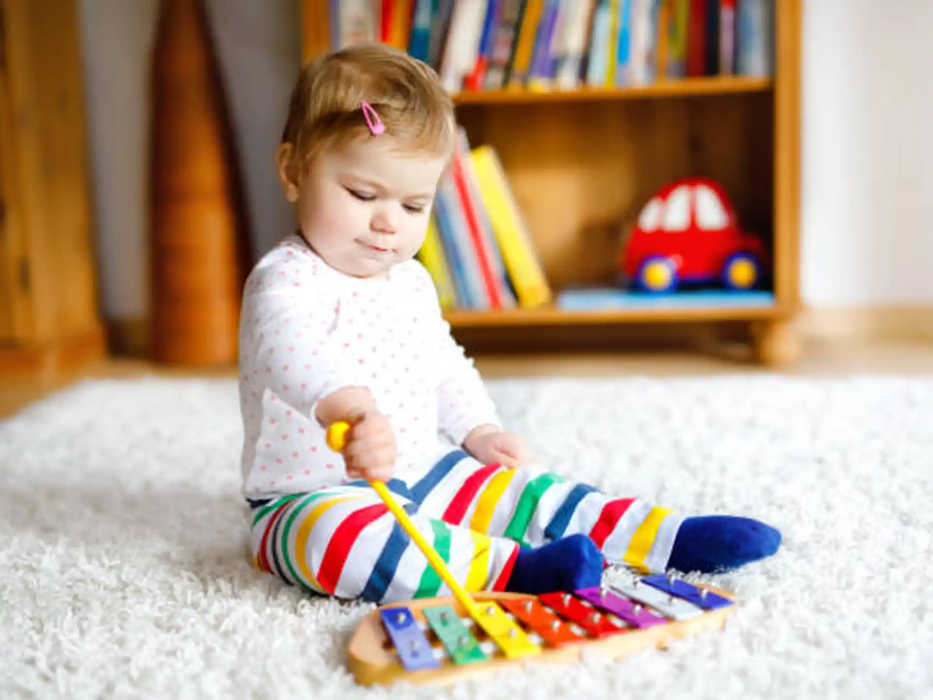 a baby sitting on the floor