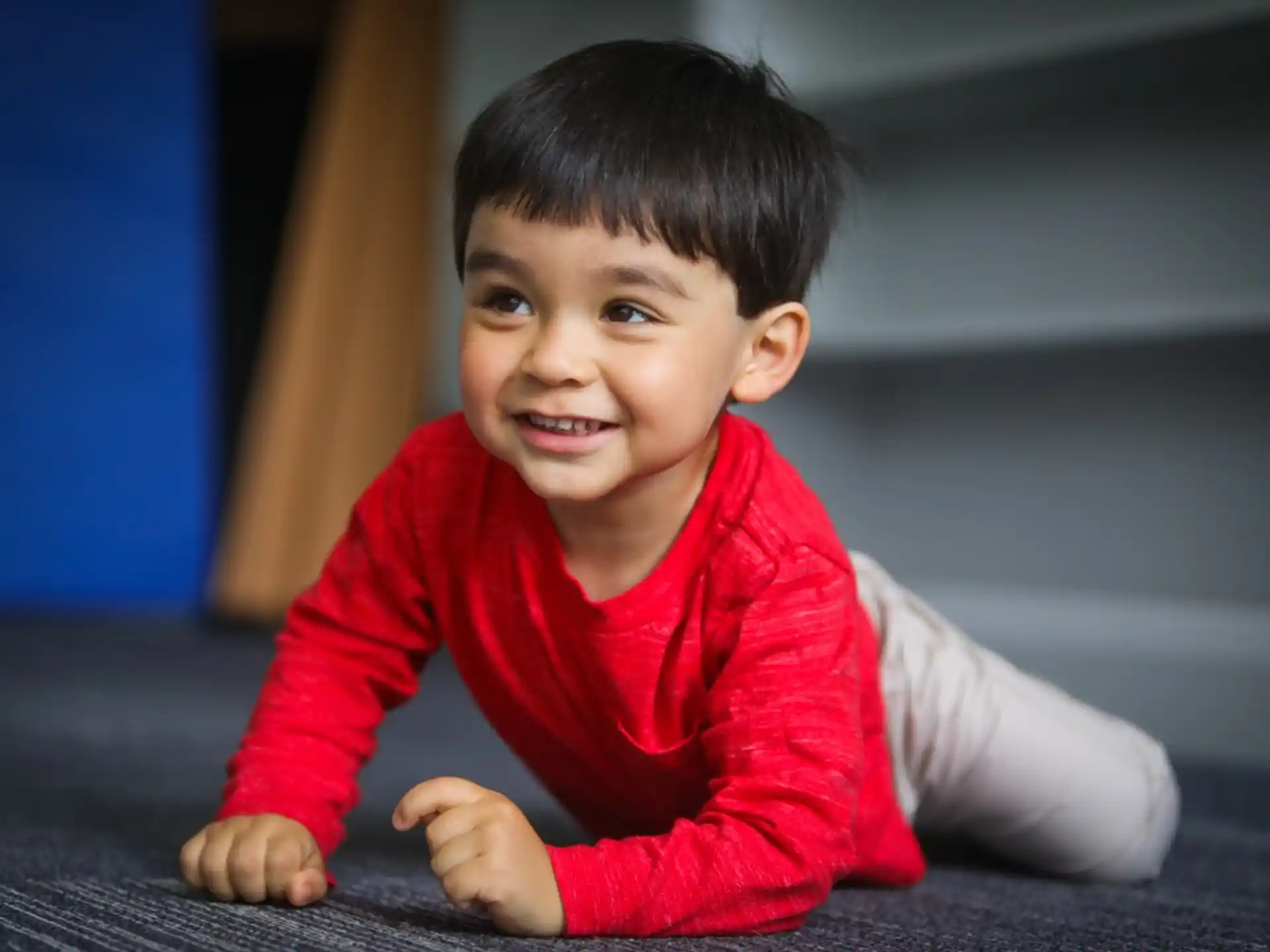 a child sitting on the floor