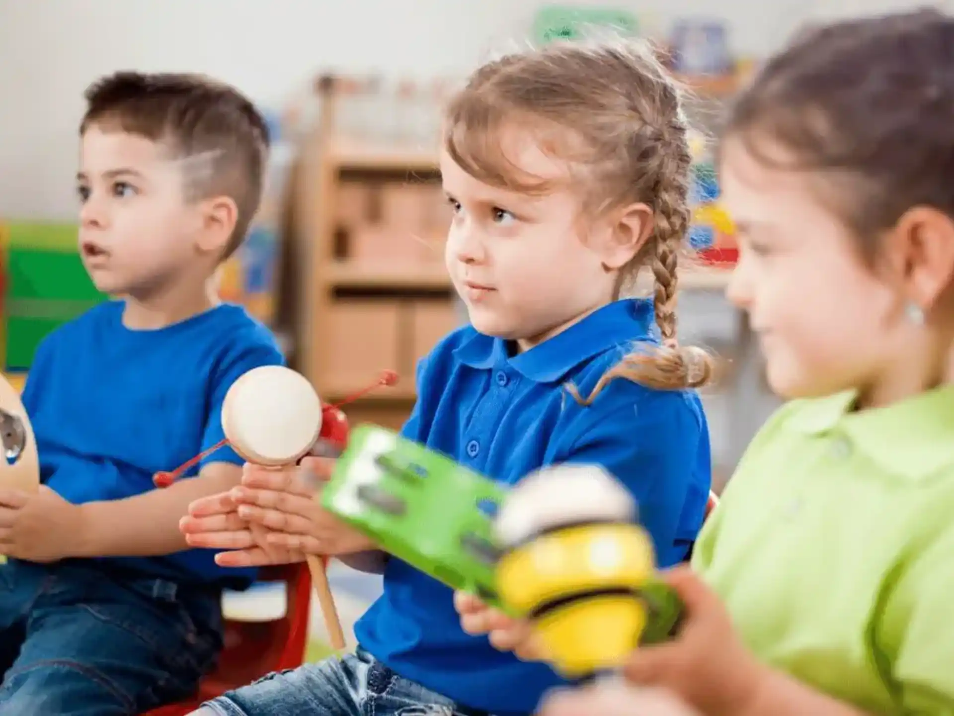 a group of children playing with toys