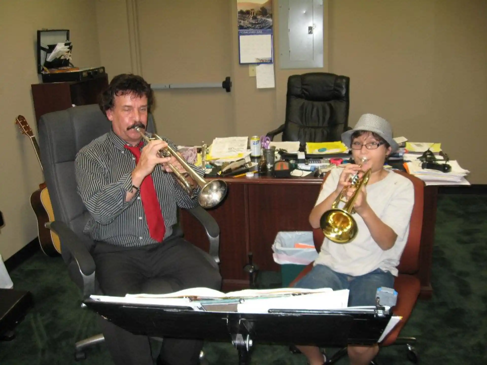 a man and woman playing instruments