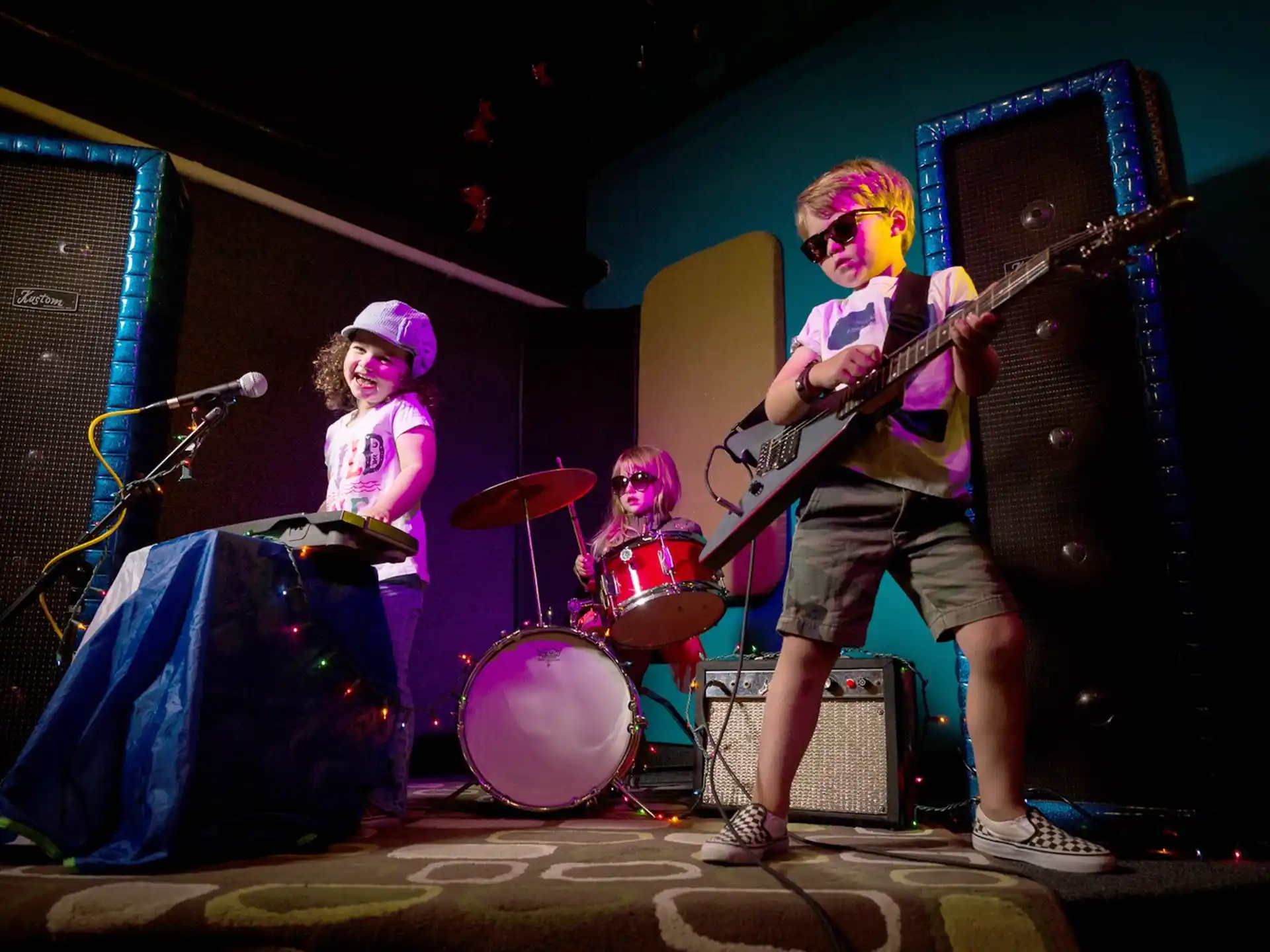 a group of people playing instruments on a stage
