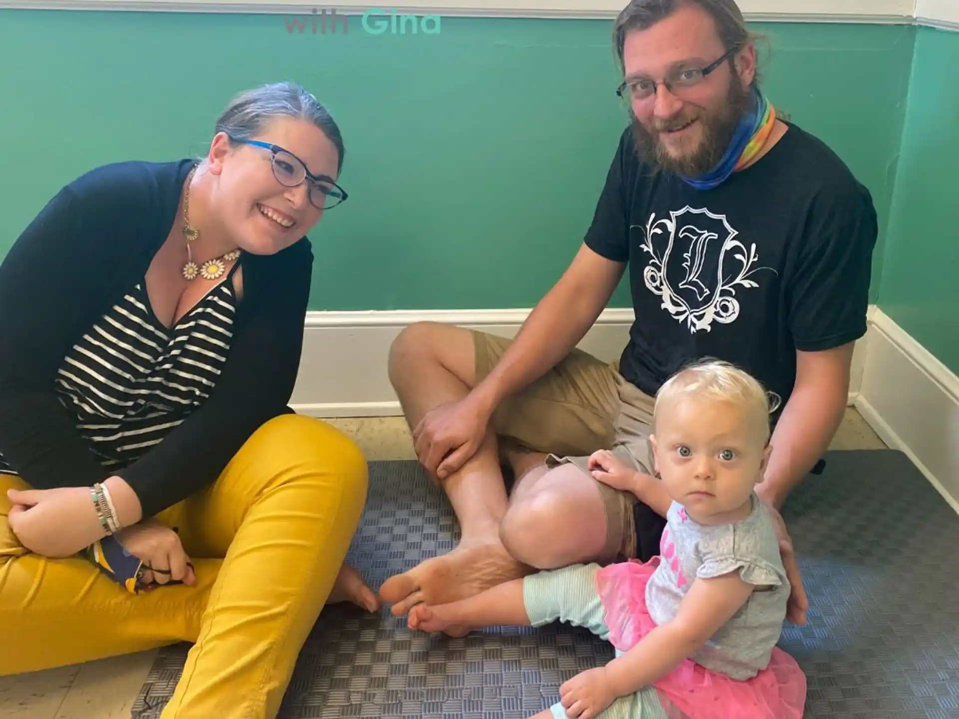 a man and woman with two babies