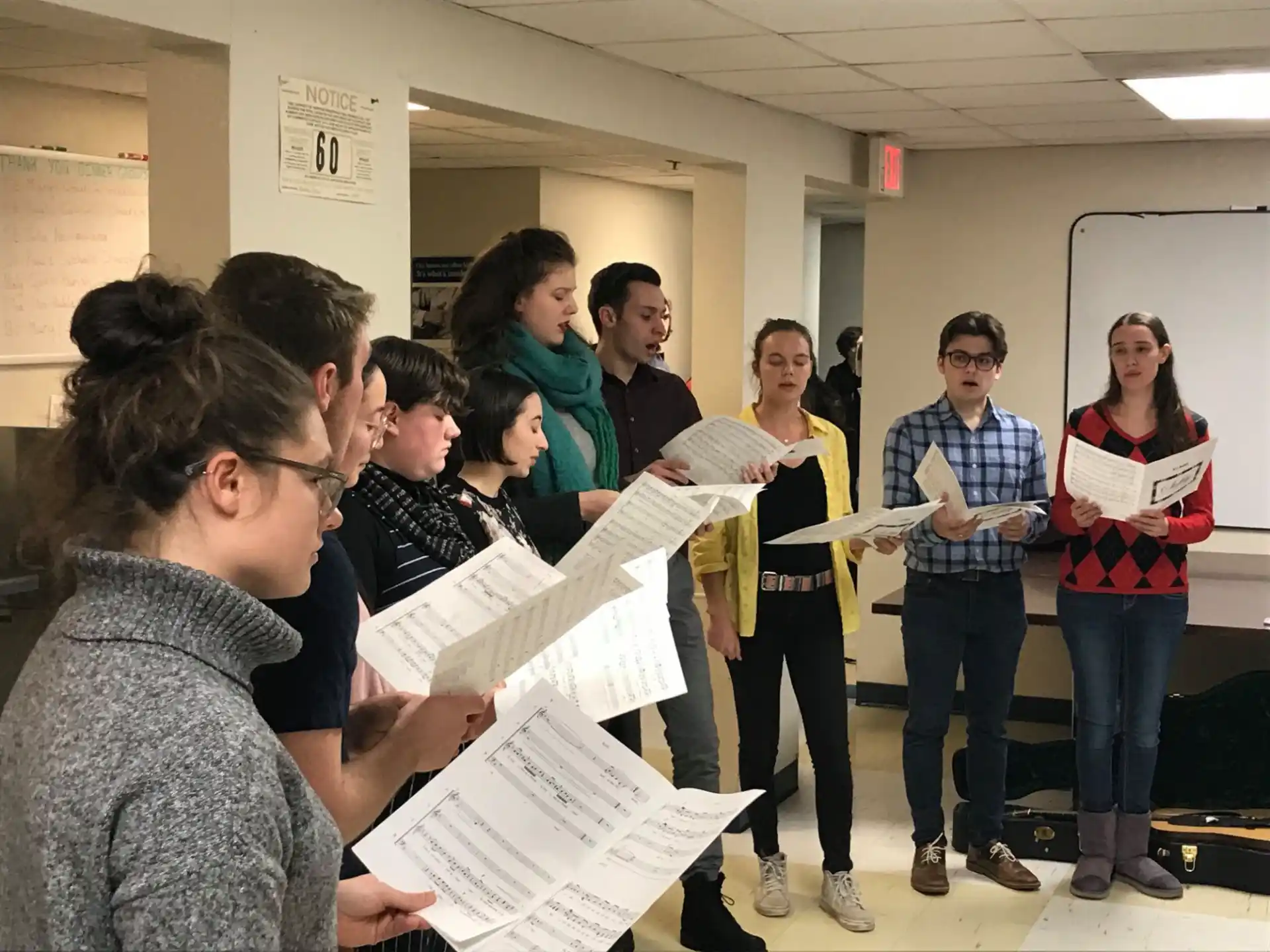a group of people looking at a paper