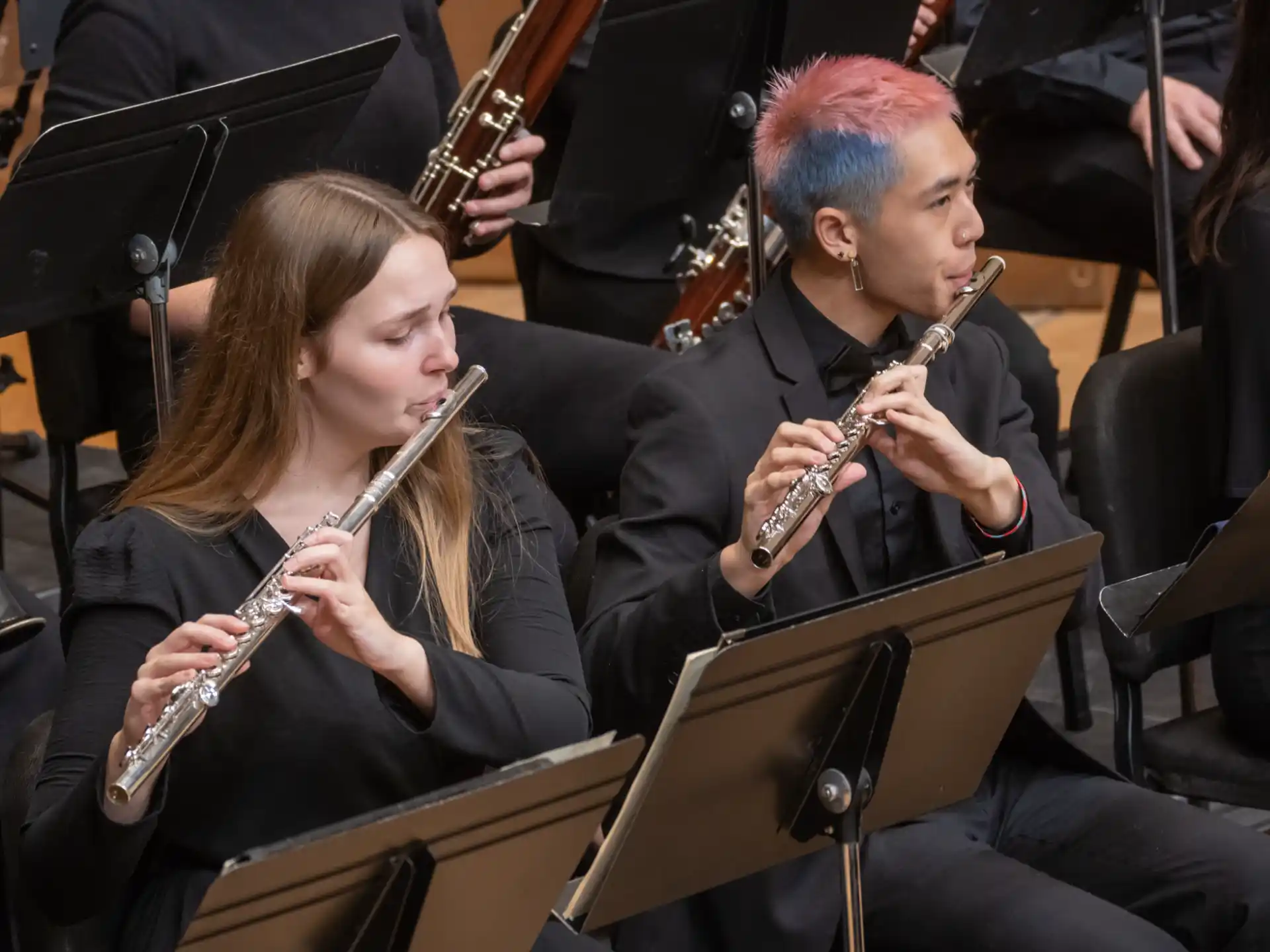 a man and woman playing instruments