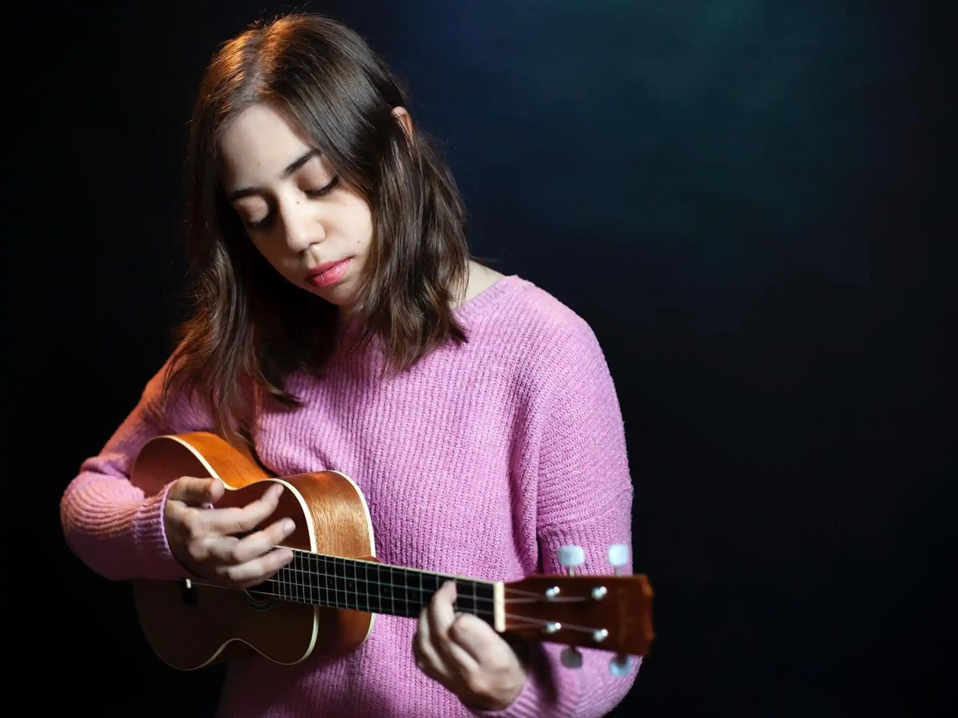 a person playing a guitar