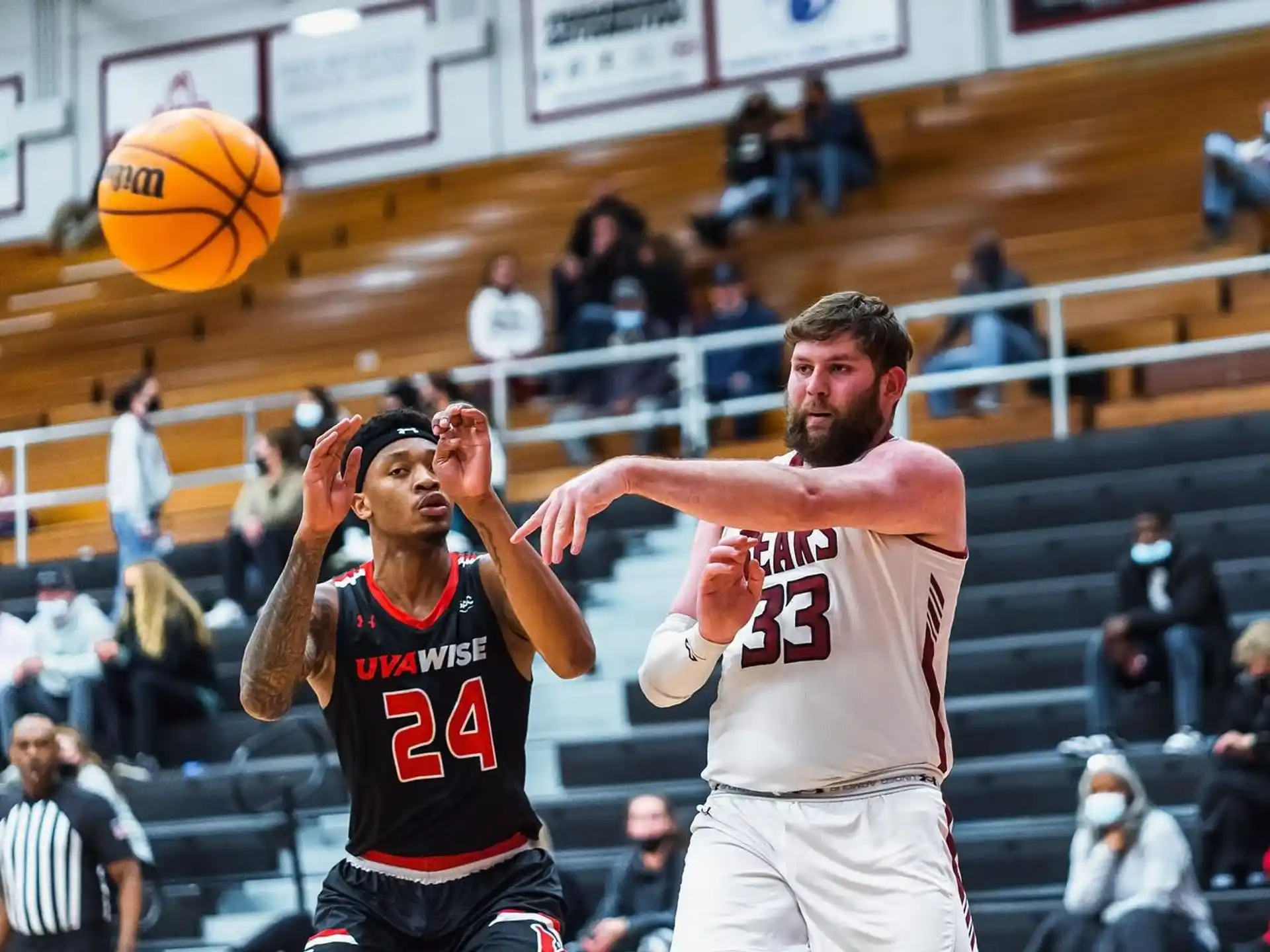 a couple of men playing basketball