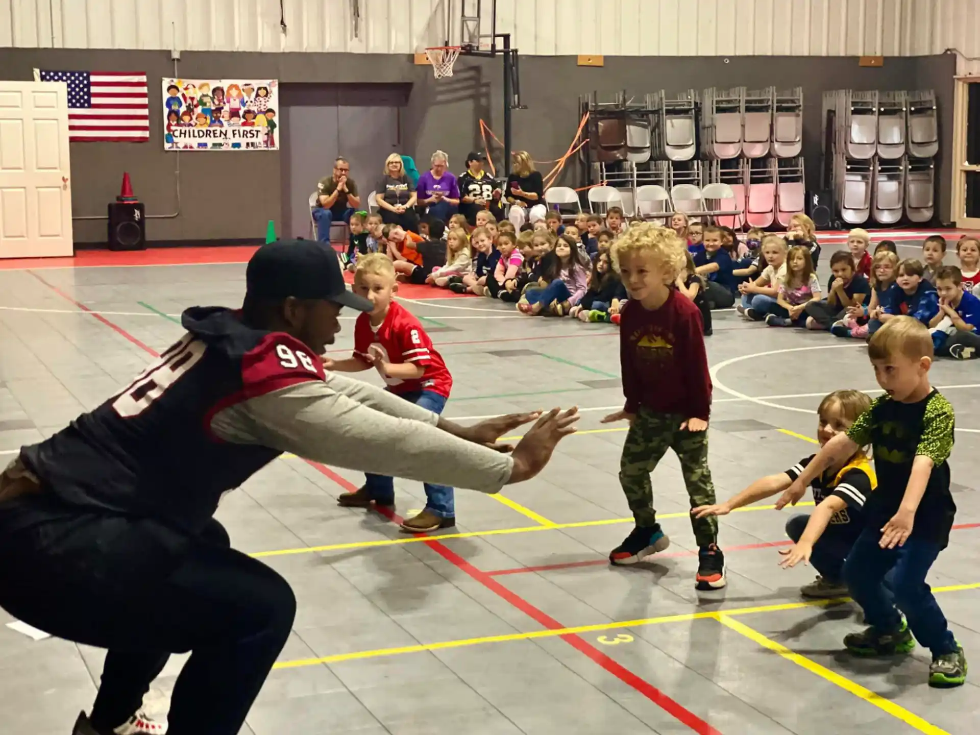 a group of kids playing basketball