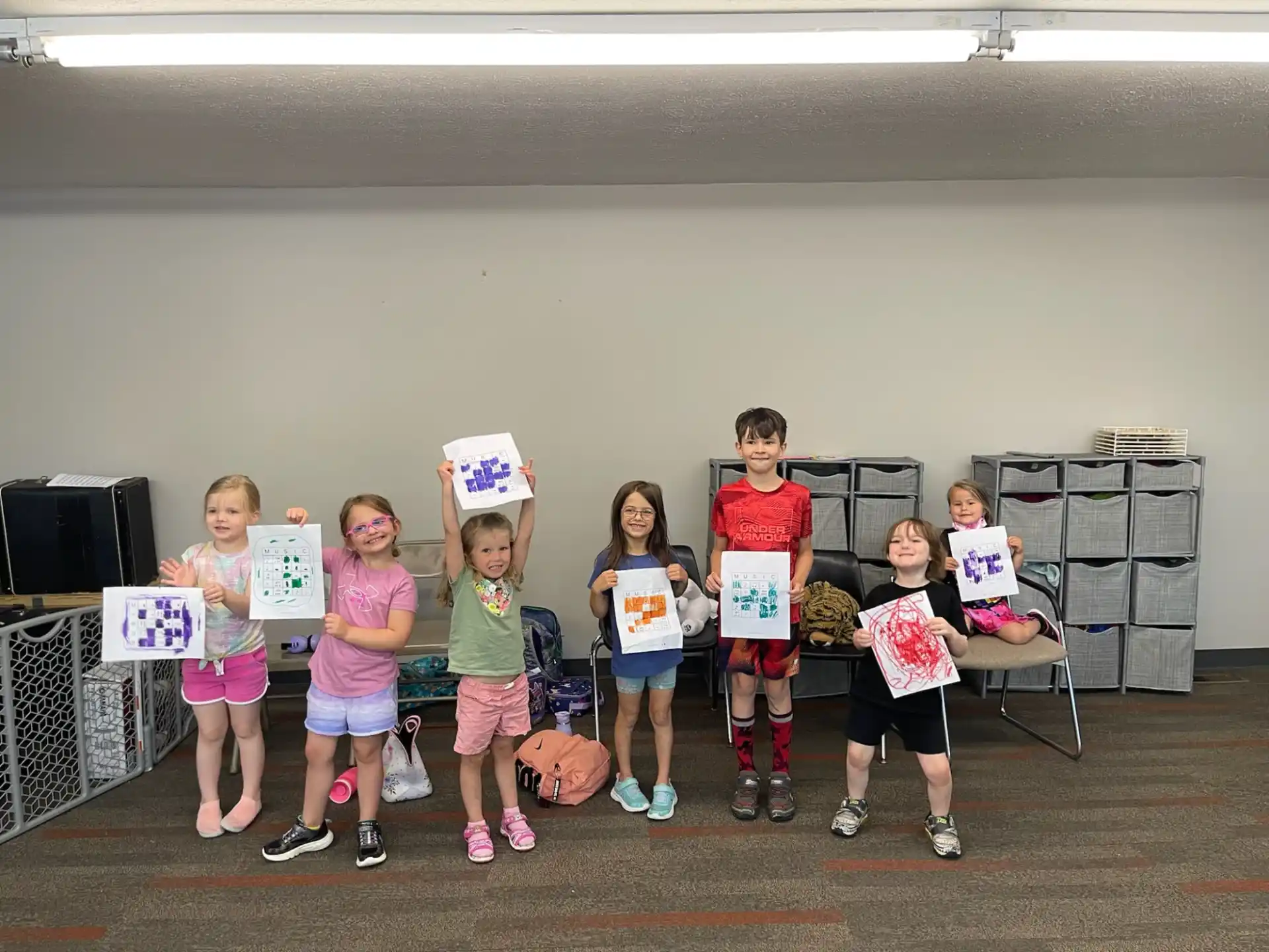 a group of children holding signs