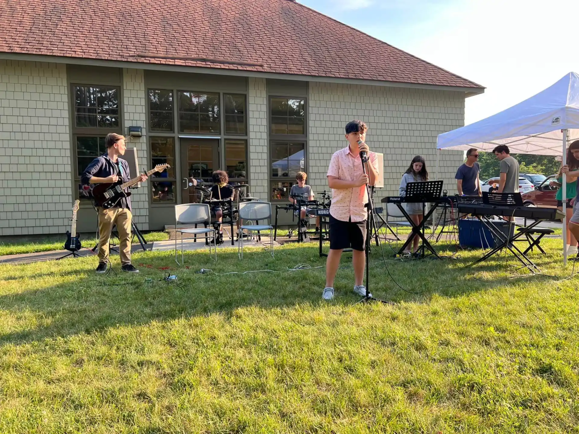 a group of people playing instruments outside