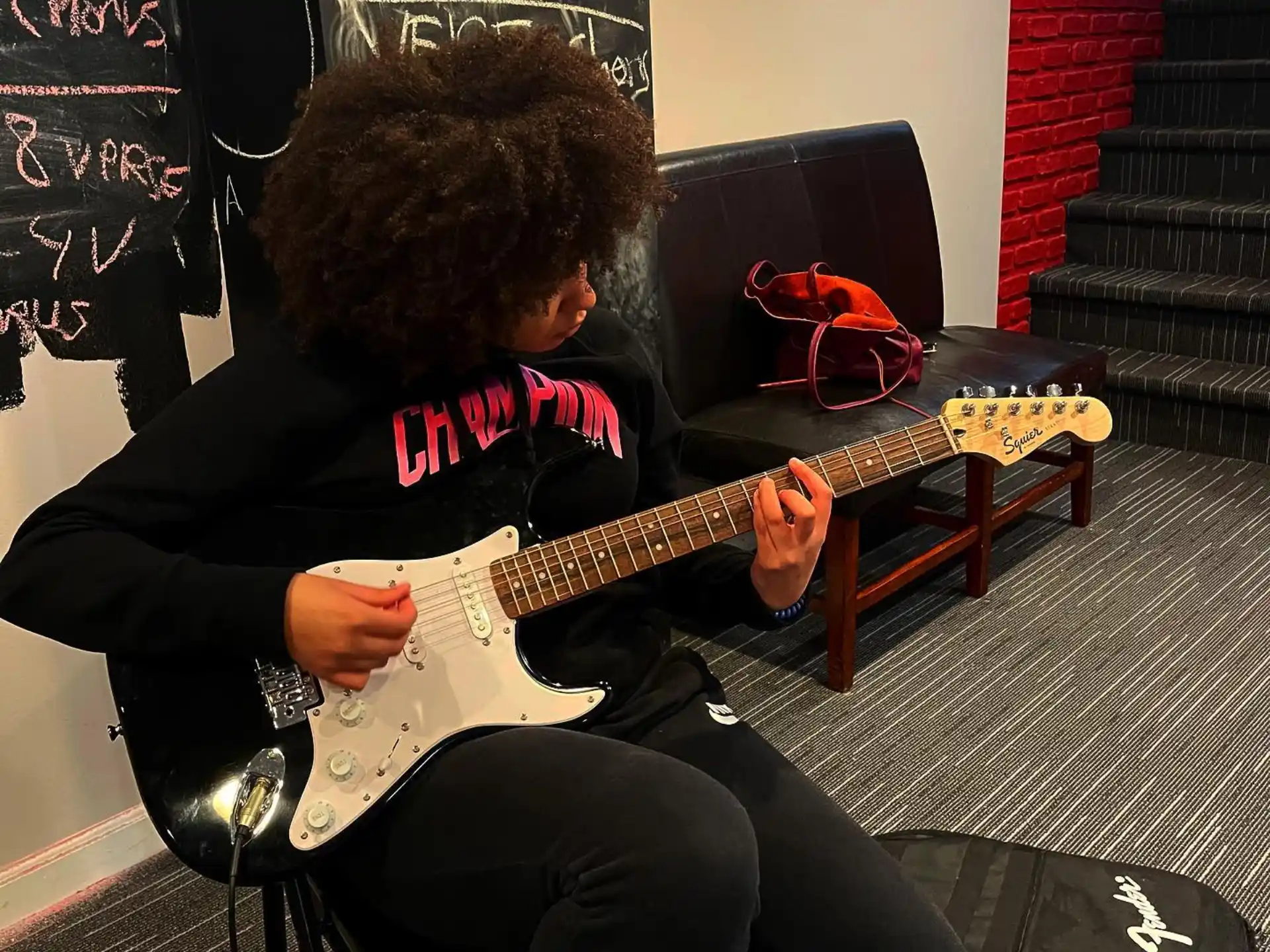 a person playing a guitar