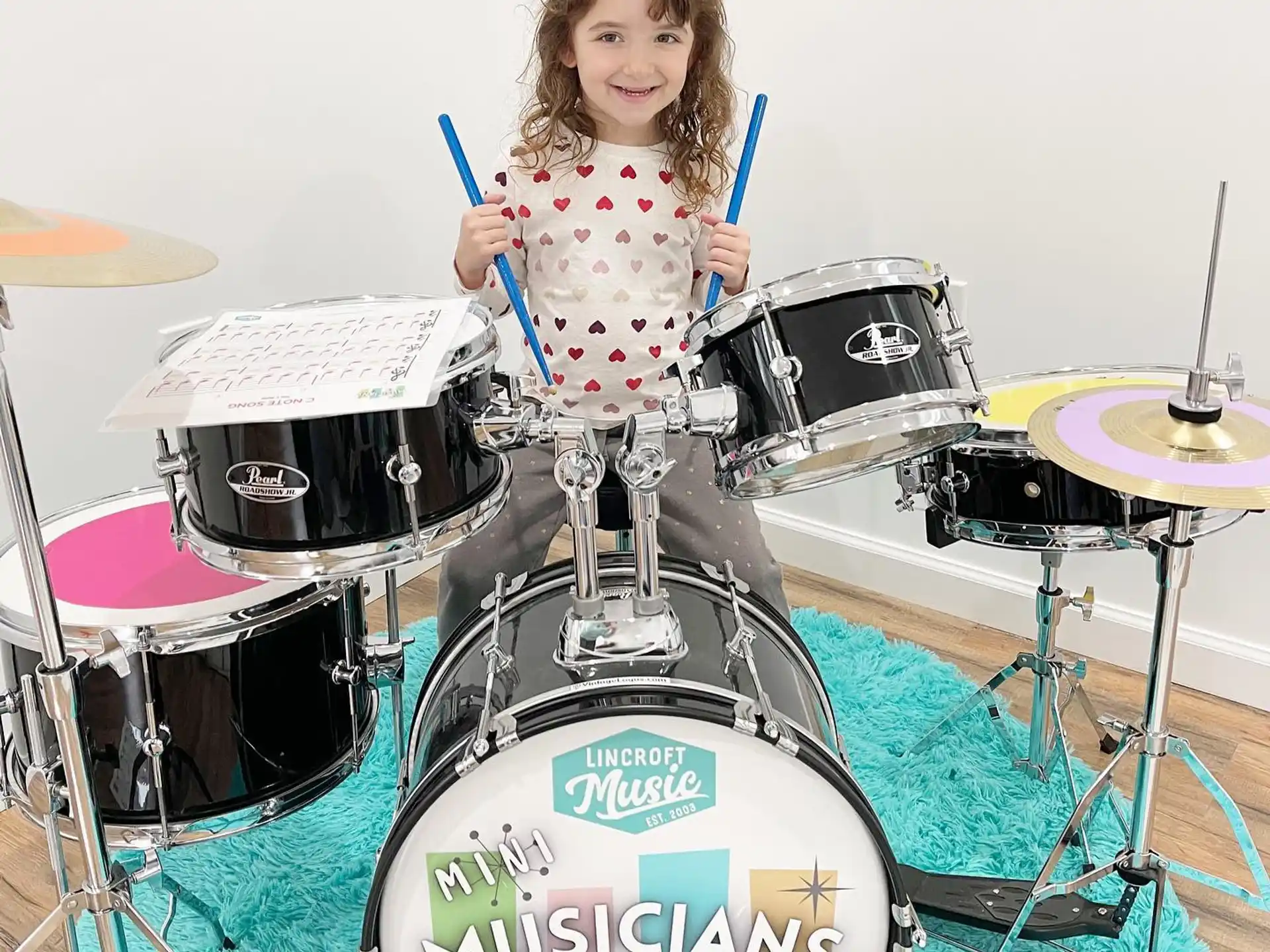 a girl playing drums