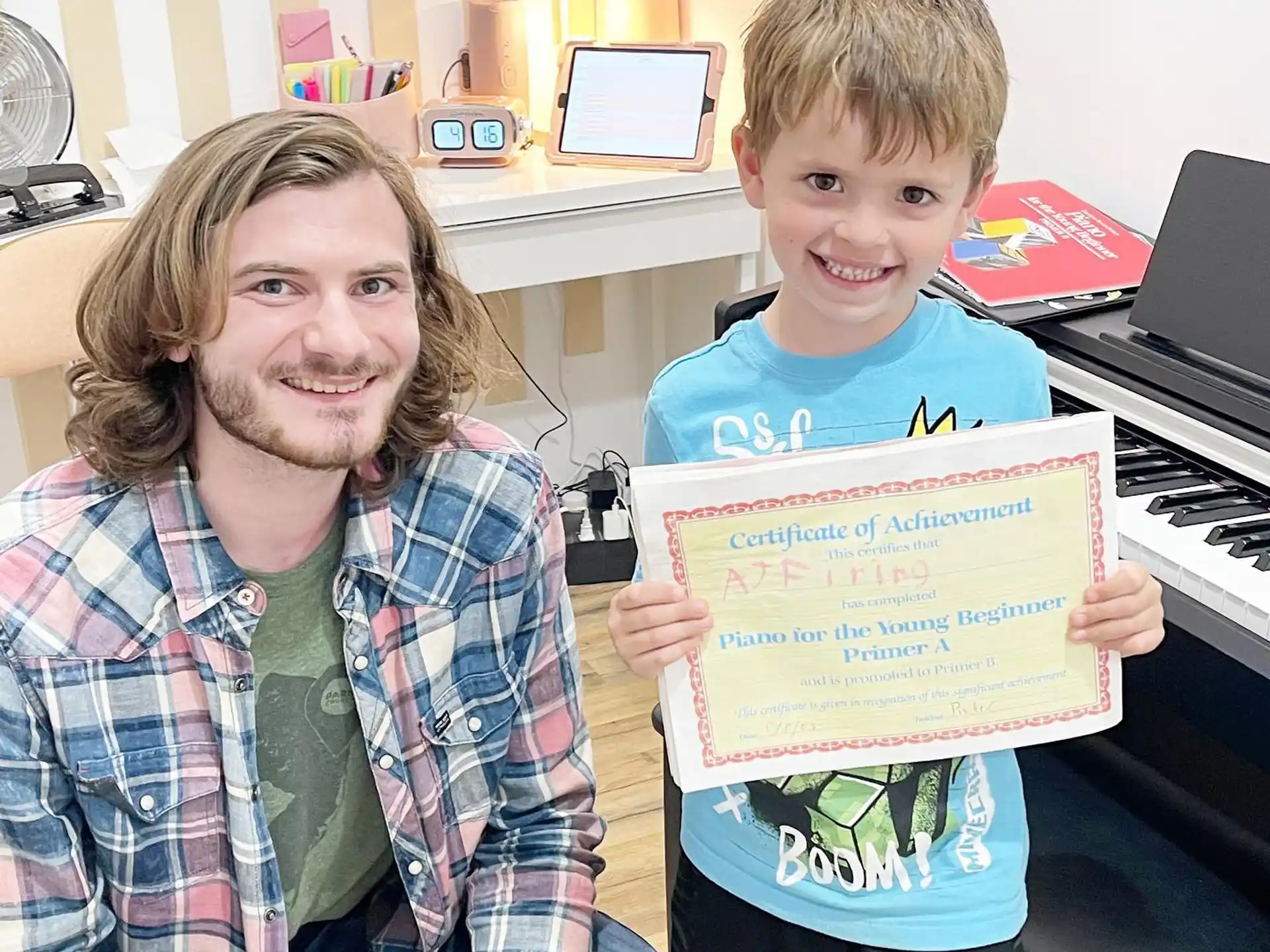 a person and a boy holding a sign