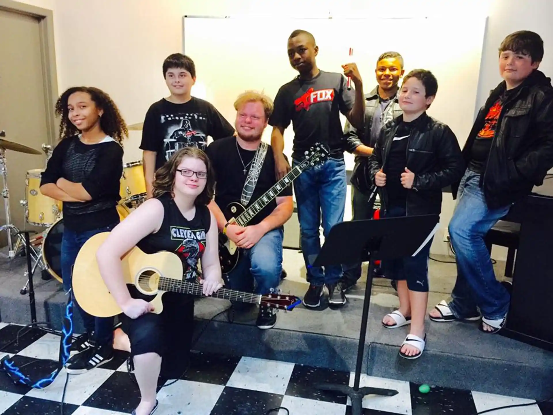 a group of people holding guitars