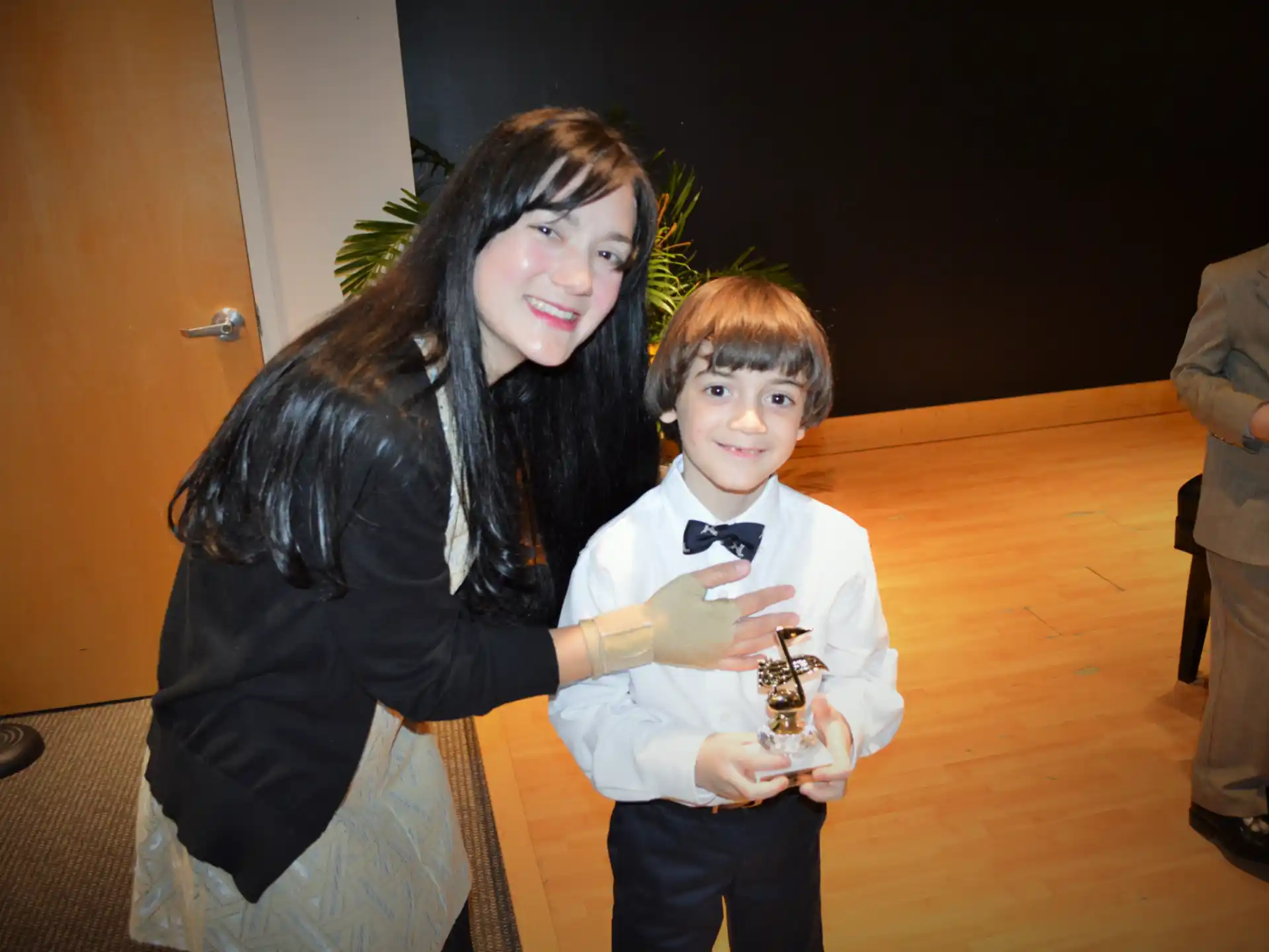 a person and a boy posing for a picture