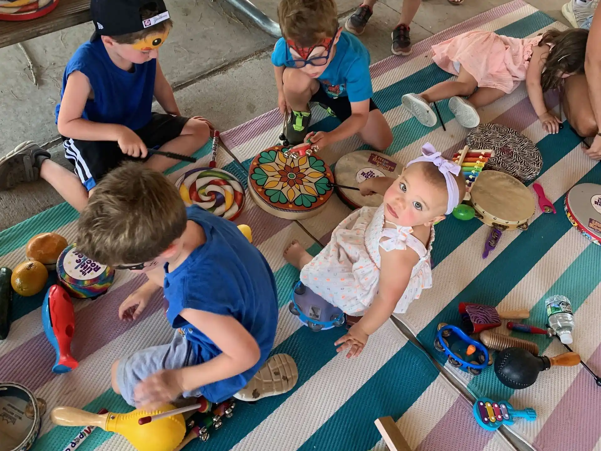 a group of children painting