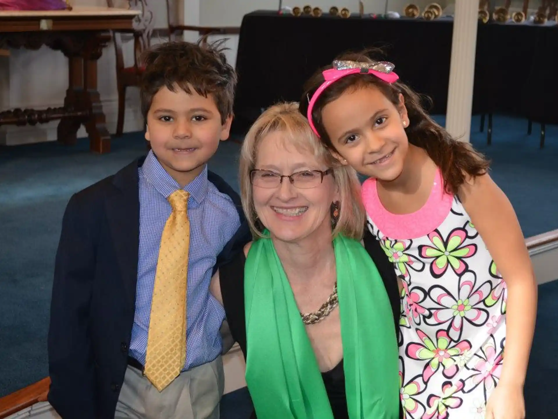a person and two children posing for a photo