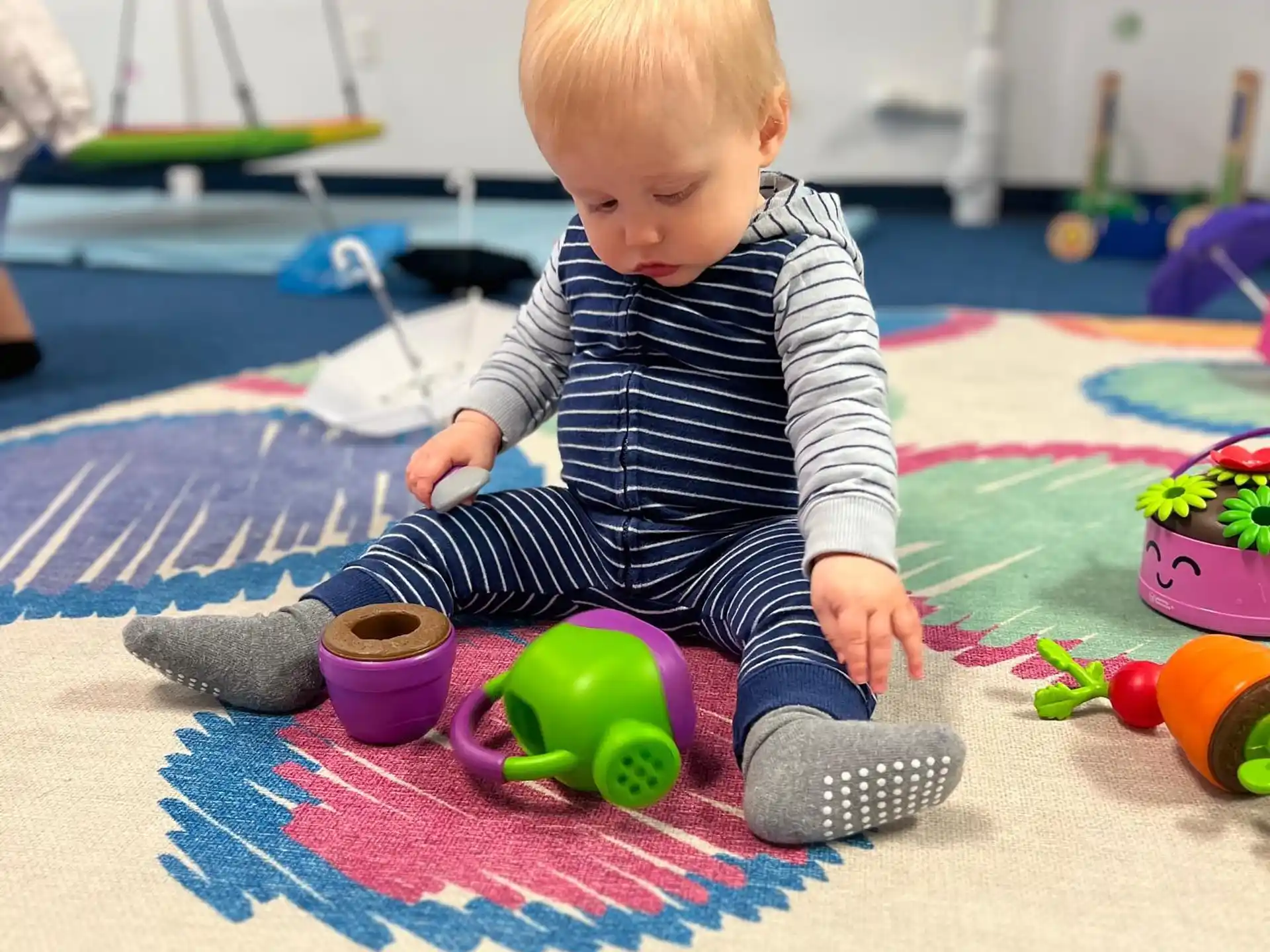 a baby playing with toys