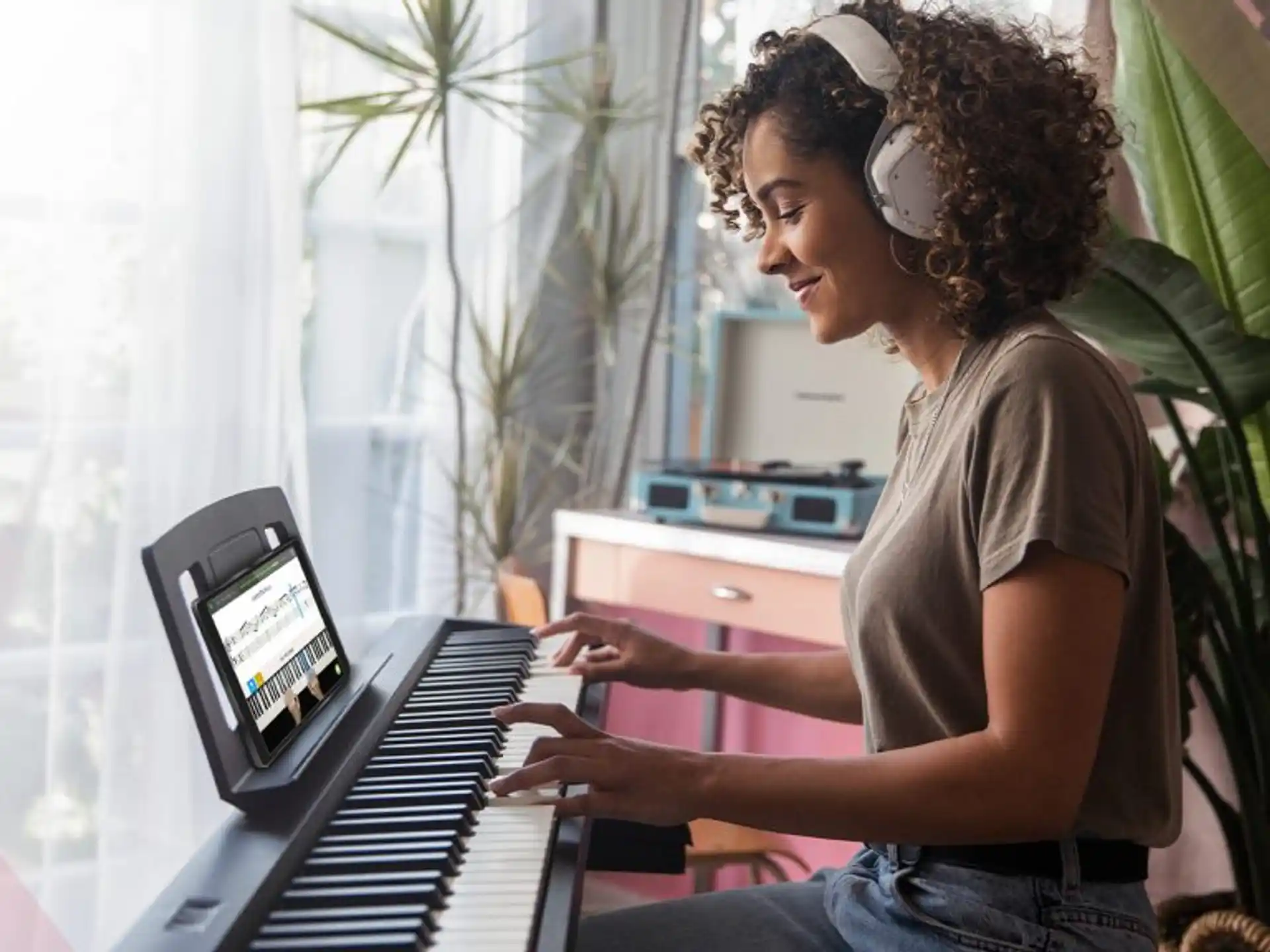 a woman playing a piano