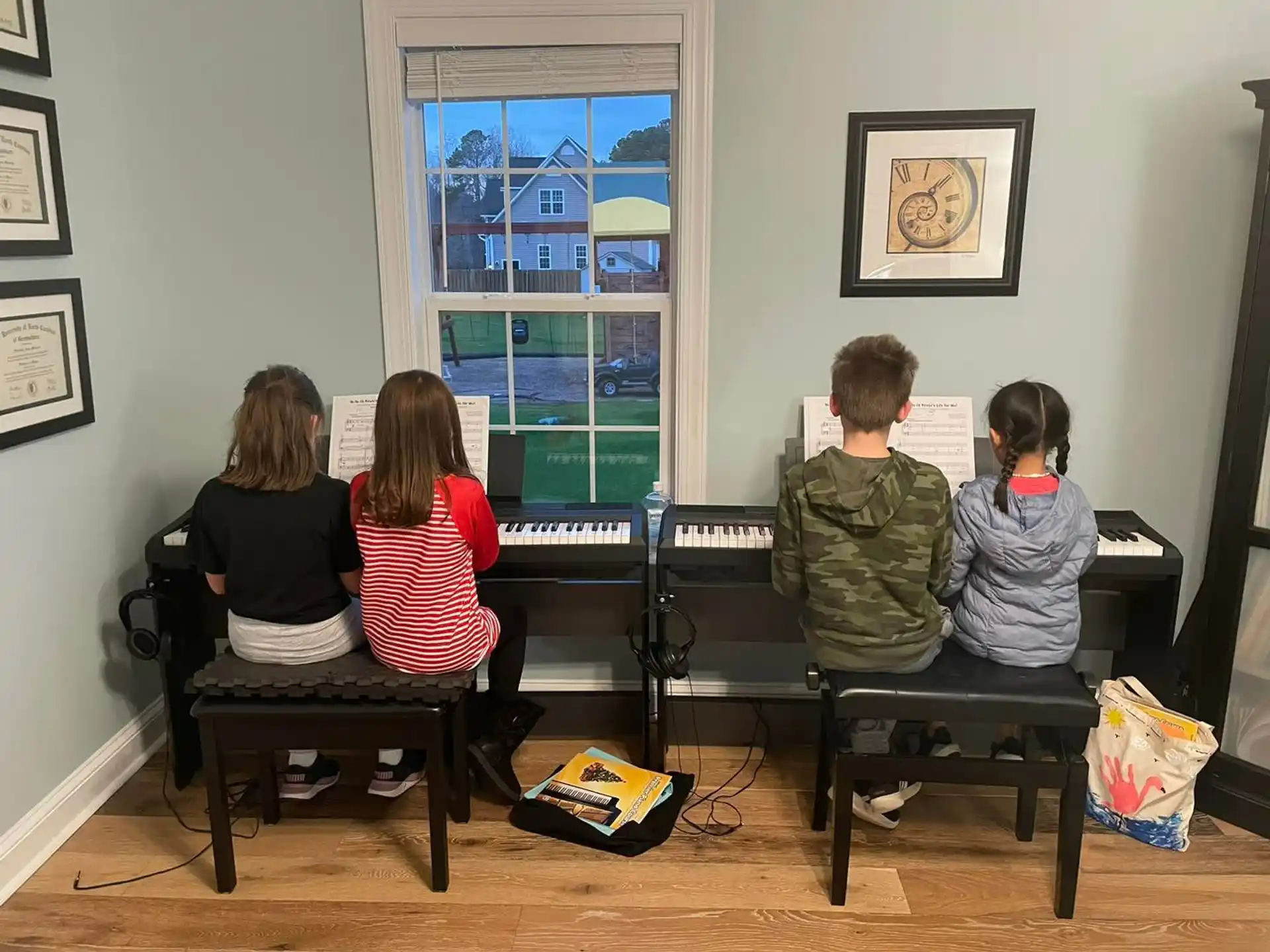 a group of children playing piano