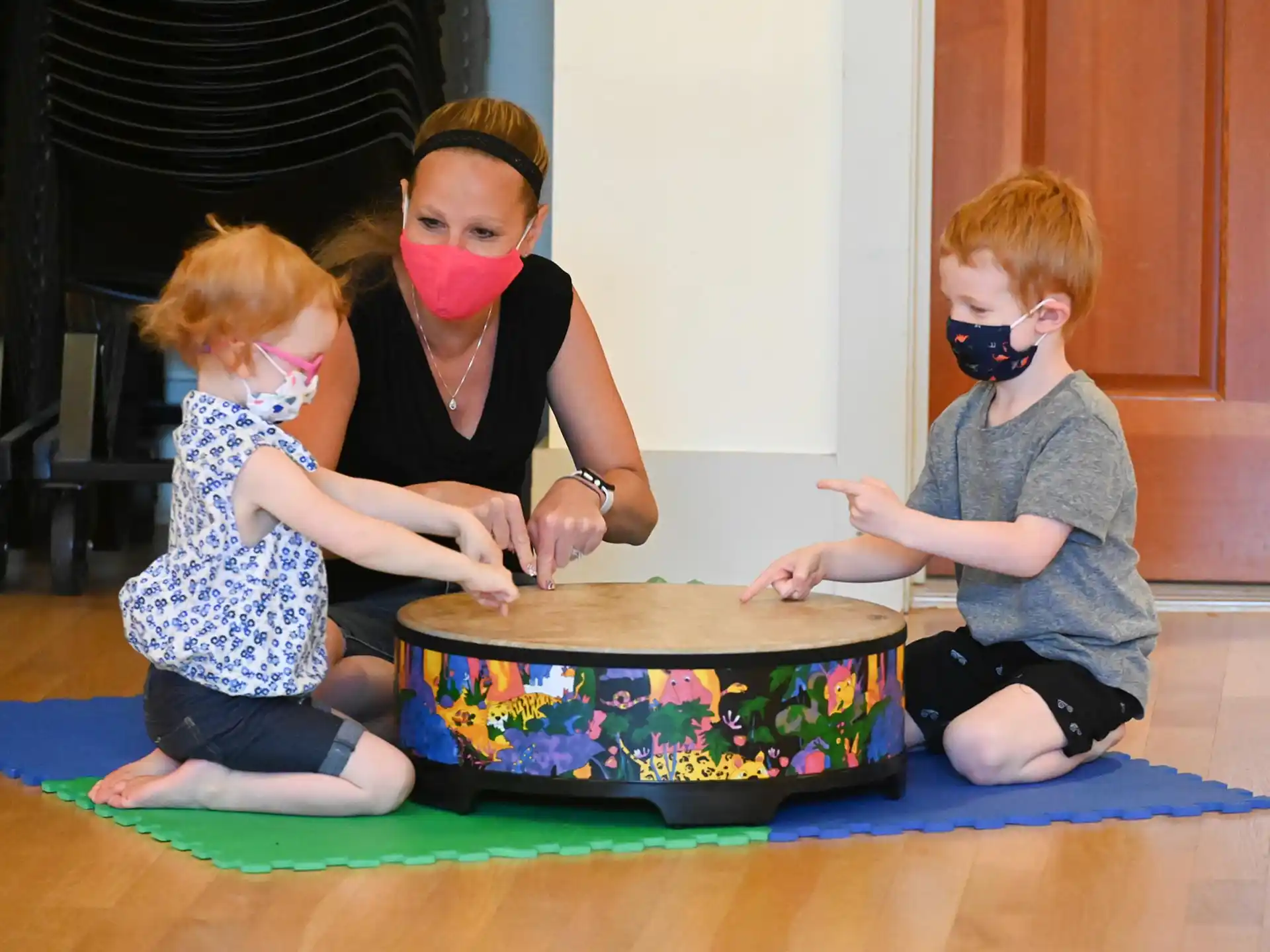 a group of children wearing masks