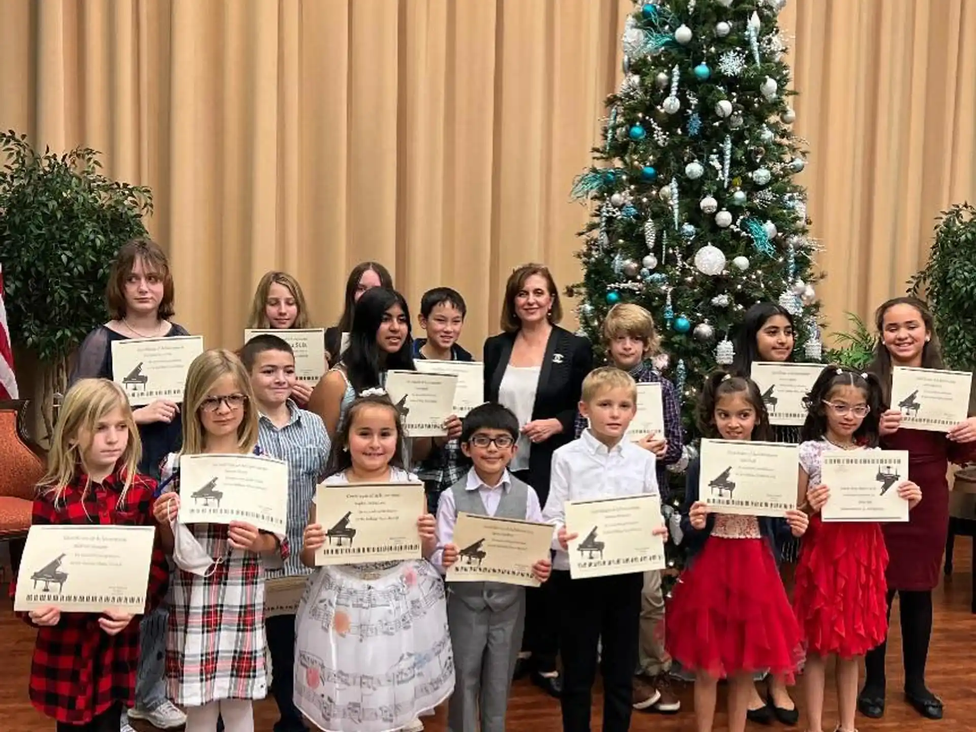 a group of children holding certificates