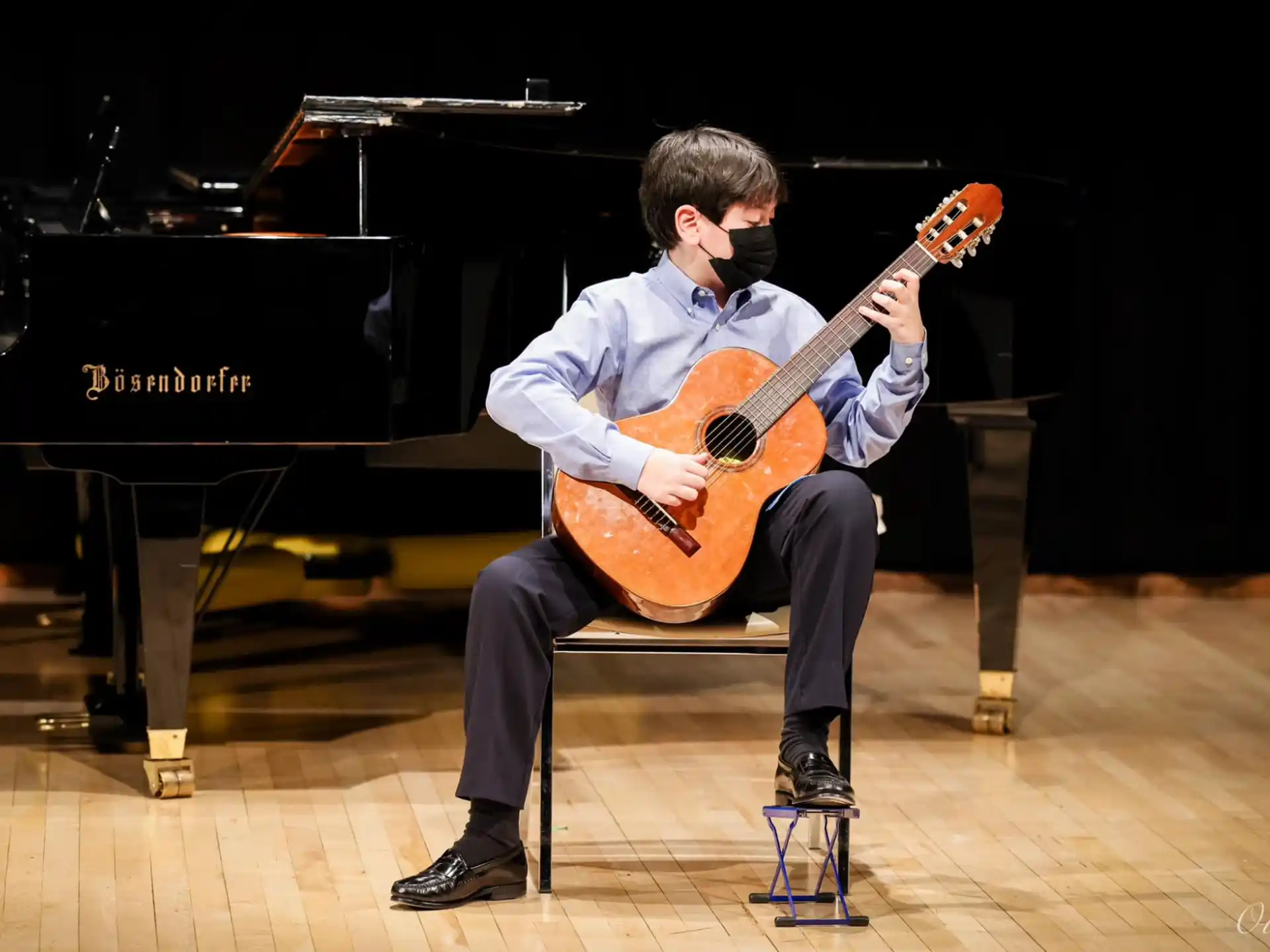 a man playing a guitar