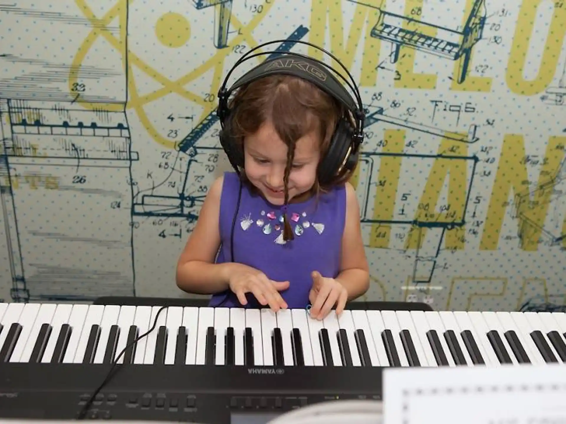 a girl playing a piano